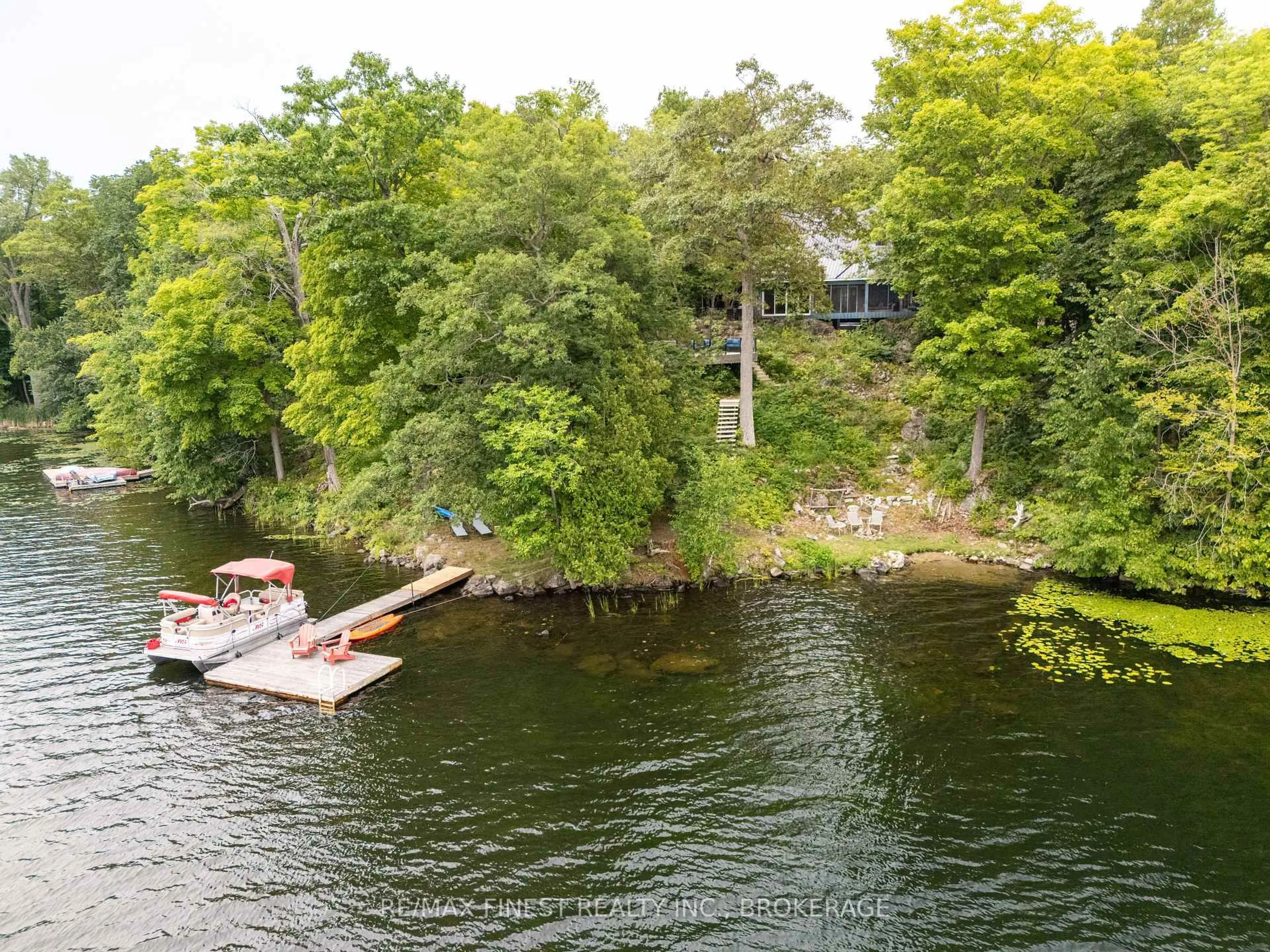 A pic from outside/outdoor area/front of a property/back of a property/a pic from drone, water/lake/river/ocean view for 8884 Canoe Lake Rd, Hartington Ontario K0H 1W0