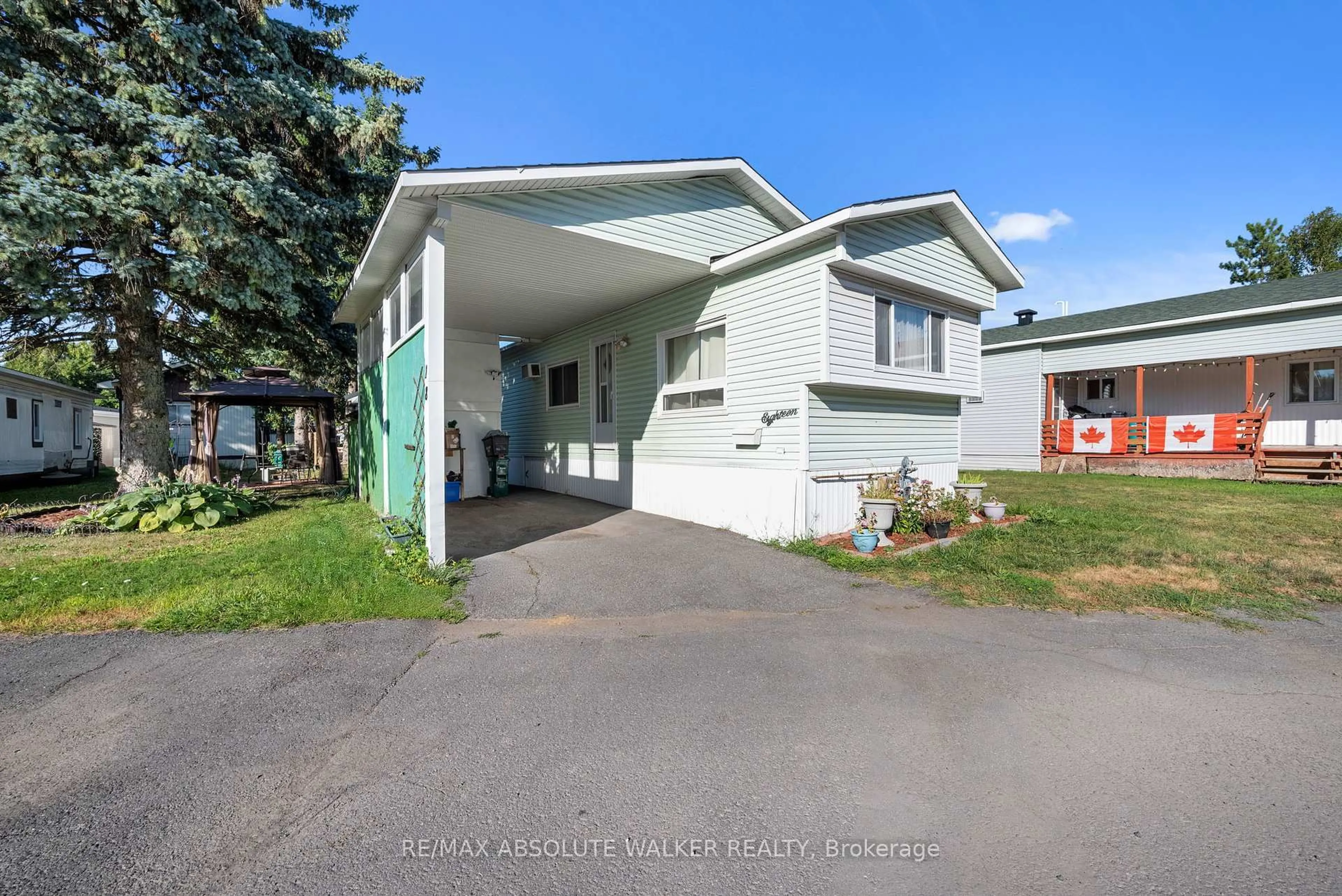 Home with vinyl exterior material, street for 18 Tracy Ave, Ottawa Ontario K2H 7P7