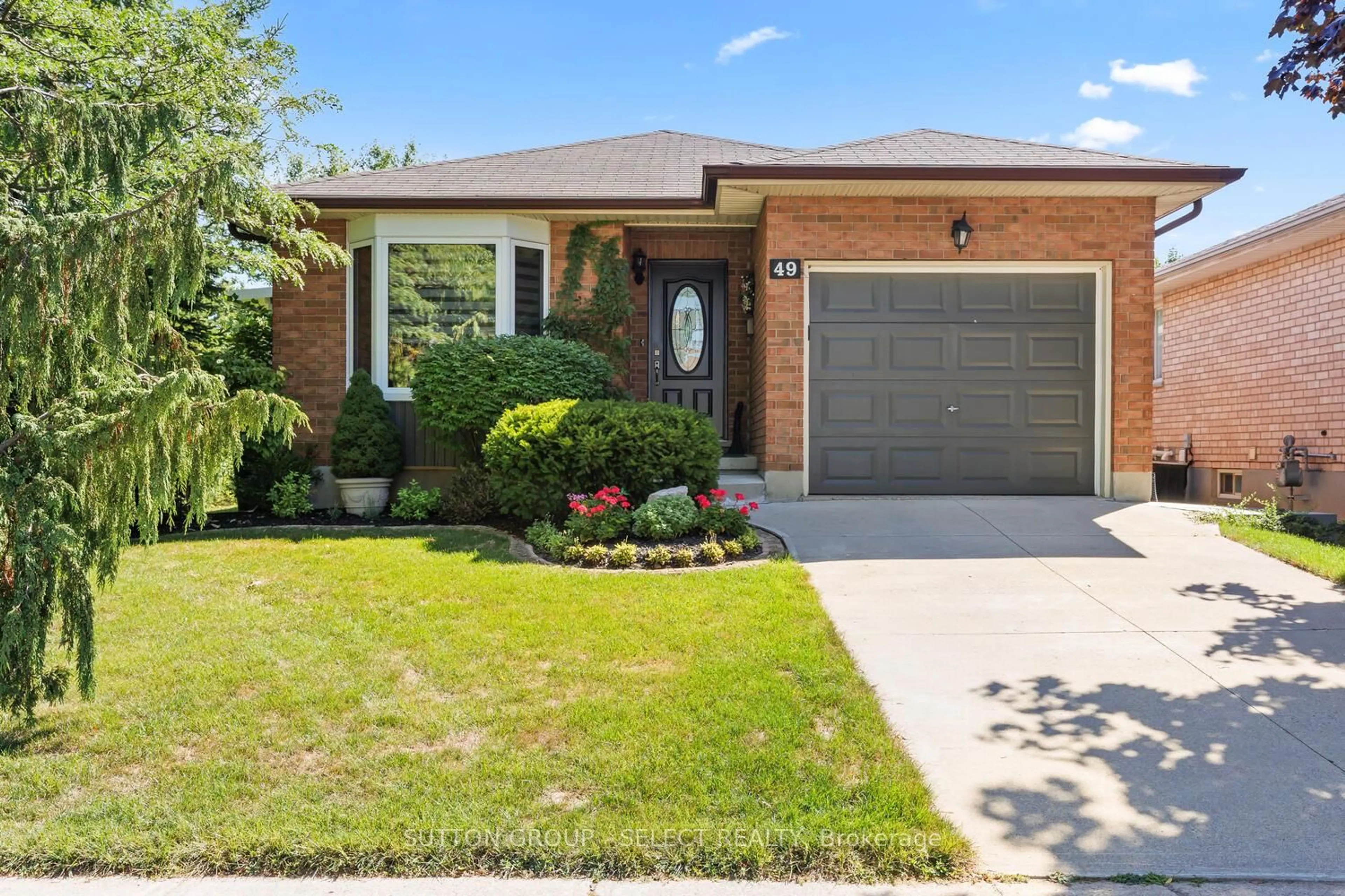 Home with brick exterior material, street for 49 Neal Ave, St. Thomas Ontario N5R 6B5