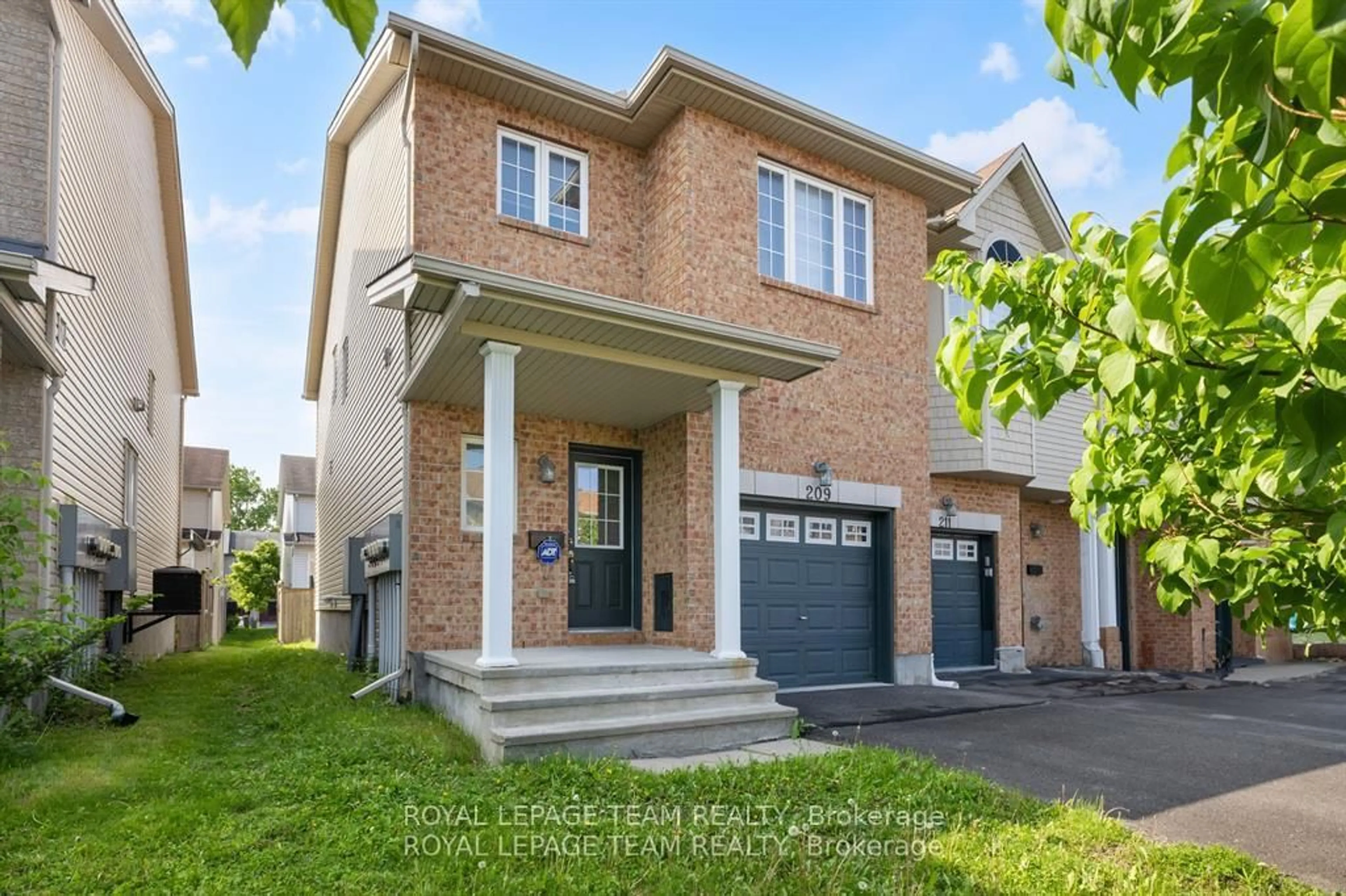 Home with brick exterior material, street for 209 Macoun Circ, Ottawa Ontario K1T 0H9