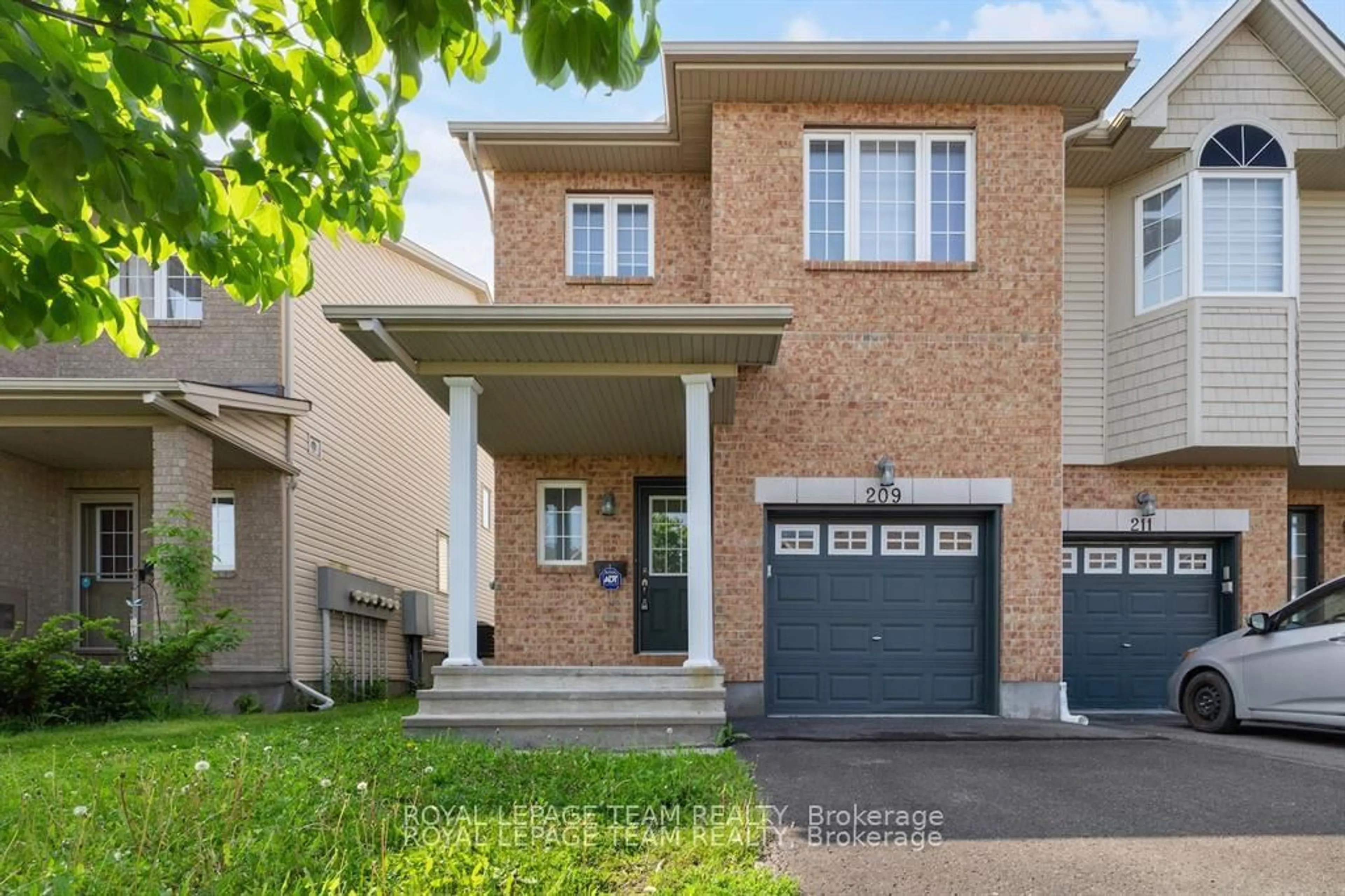 Home with brick exterior material, street for 209 Macoun Circ, Ottawa Ontario K1T 0H9