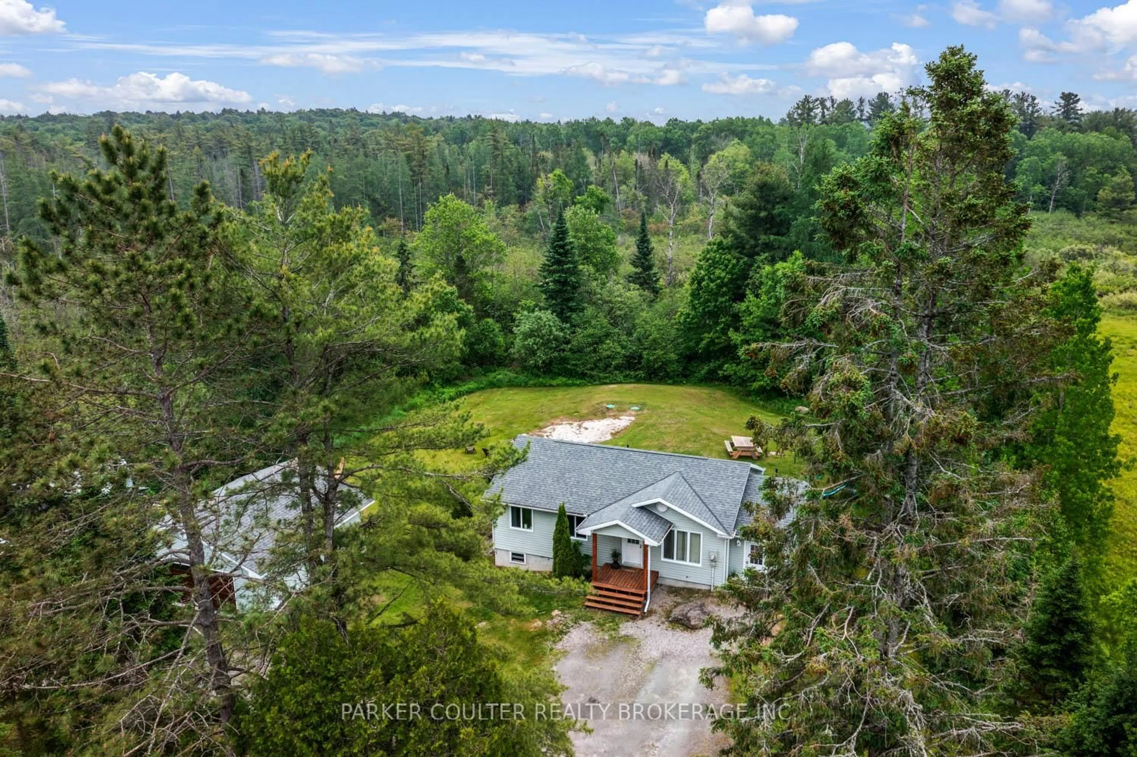 A pic from outside/outdoor area/front of a property/back of a property/a pic from drone, forest/trees view for 115 Mccans Rd, Seguin Ontario P0C 1J0
