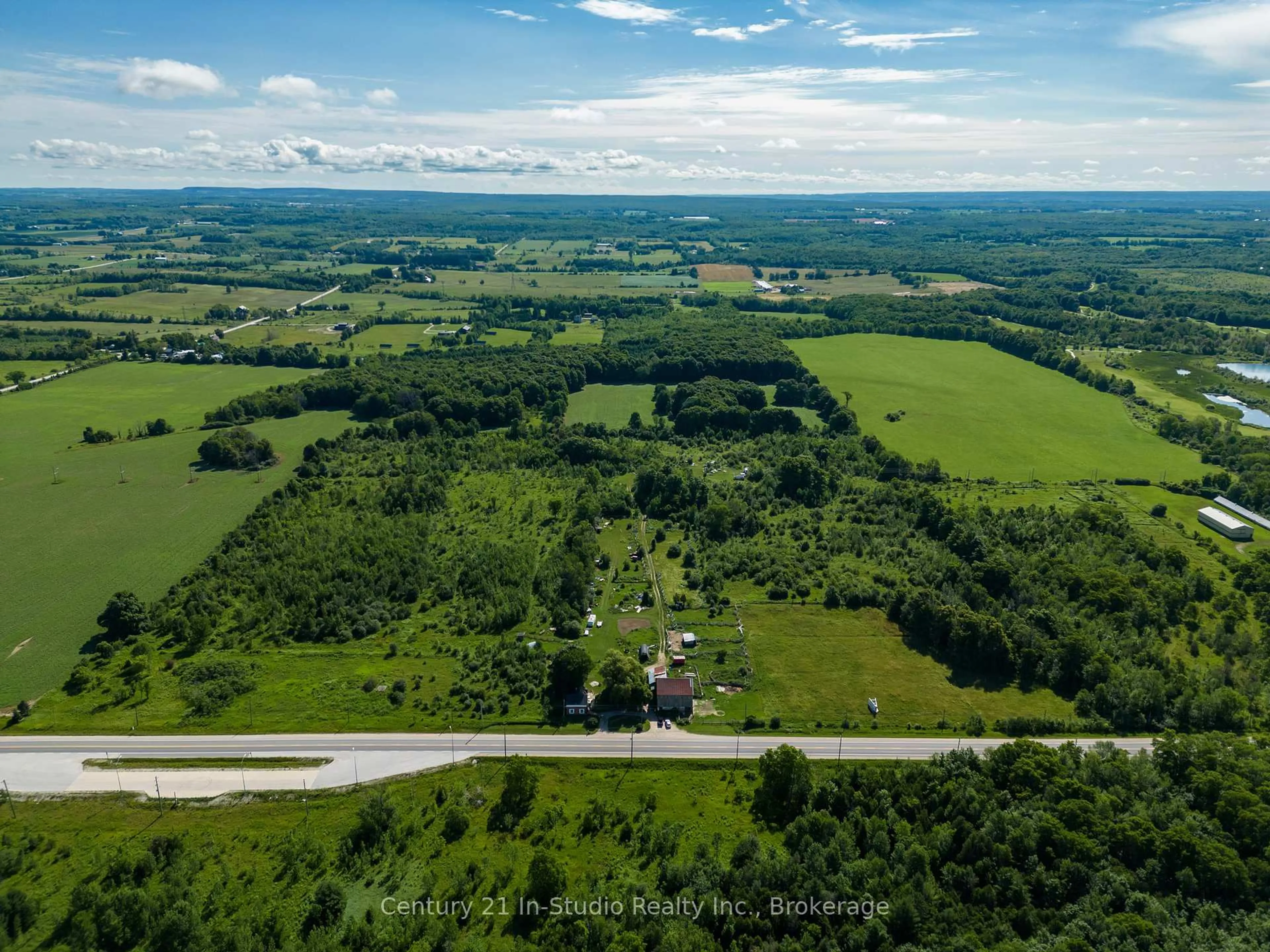 A pic from outside/outdoor area/front of a property/back of a property/a pic from drone, unknown for 318143 6 & 10 Highway, Meaford Ontario N4K 6K9