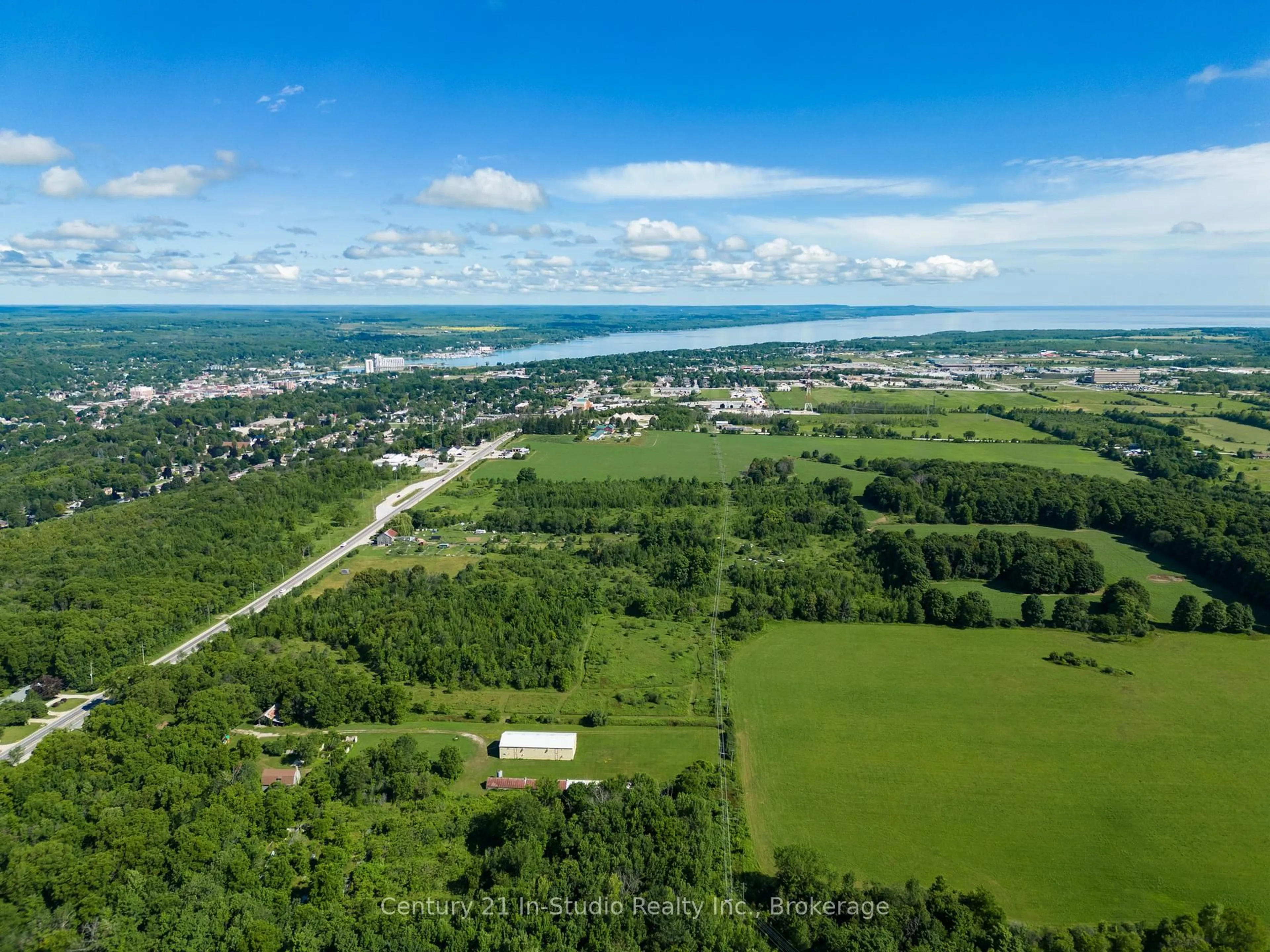 A pic from outside/outdoor area/front of a property/back of a property/a pic from drone, water/lake/river/ocean view for 318143 6 & 10 Highway, Meaford Ontario N4K 6K9