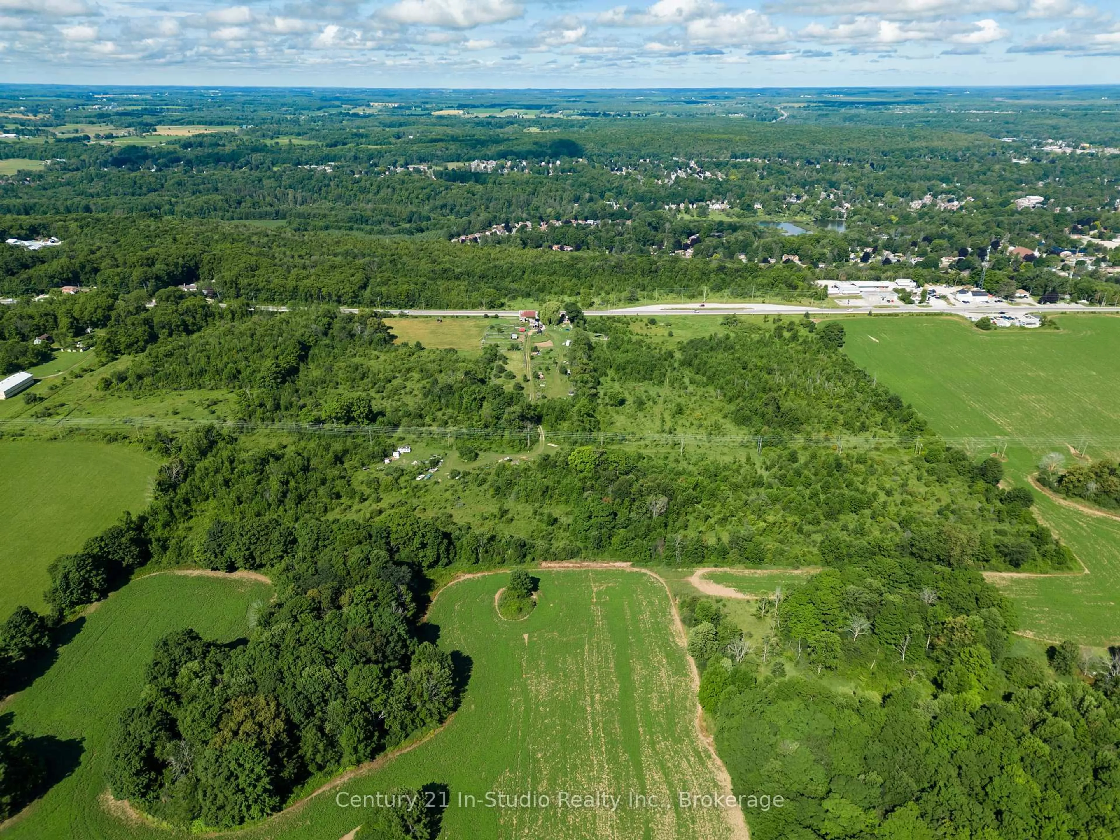 A pic from outside/outdoor area/front of a property/back of a property/a pic from drone, forest/trees view for 318143 6 & 10 Highway, Meaford Ontario N4K 6K9