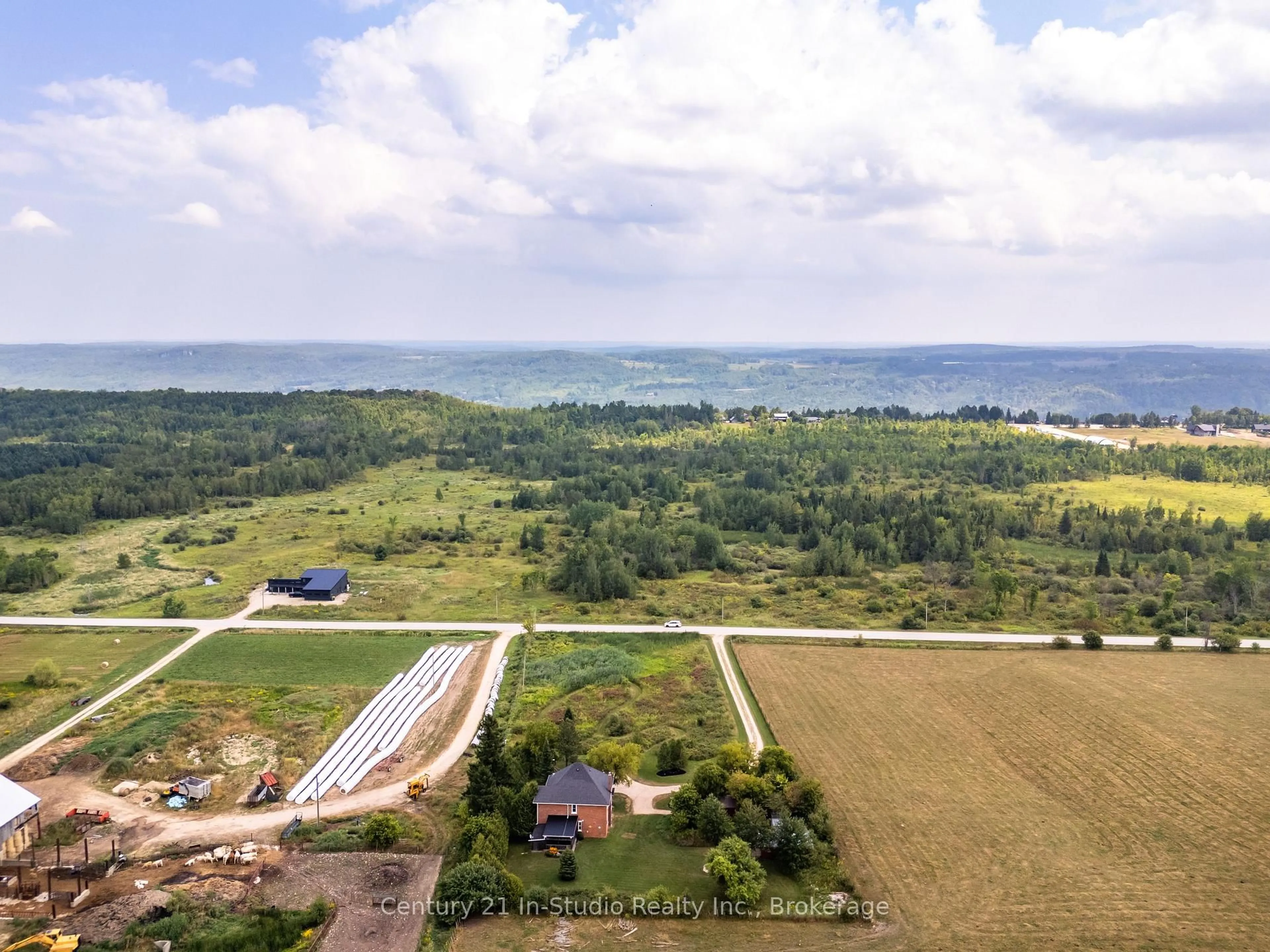 A pic from outside/outdoor area/front of a property/back of a property/a pic from drone, water/lake/river/ocean view for 155104 7th Line, Grey Highlands Ontario N0C 1H0