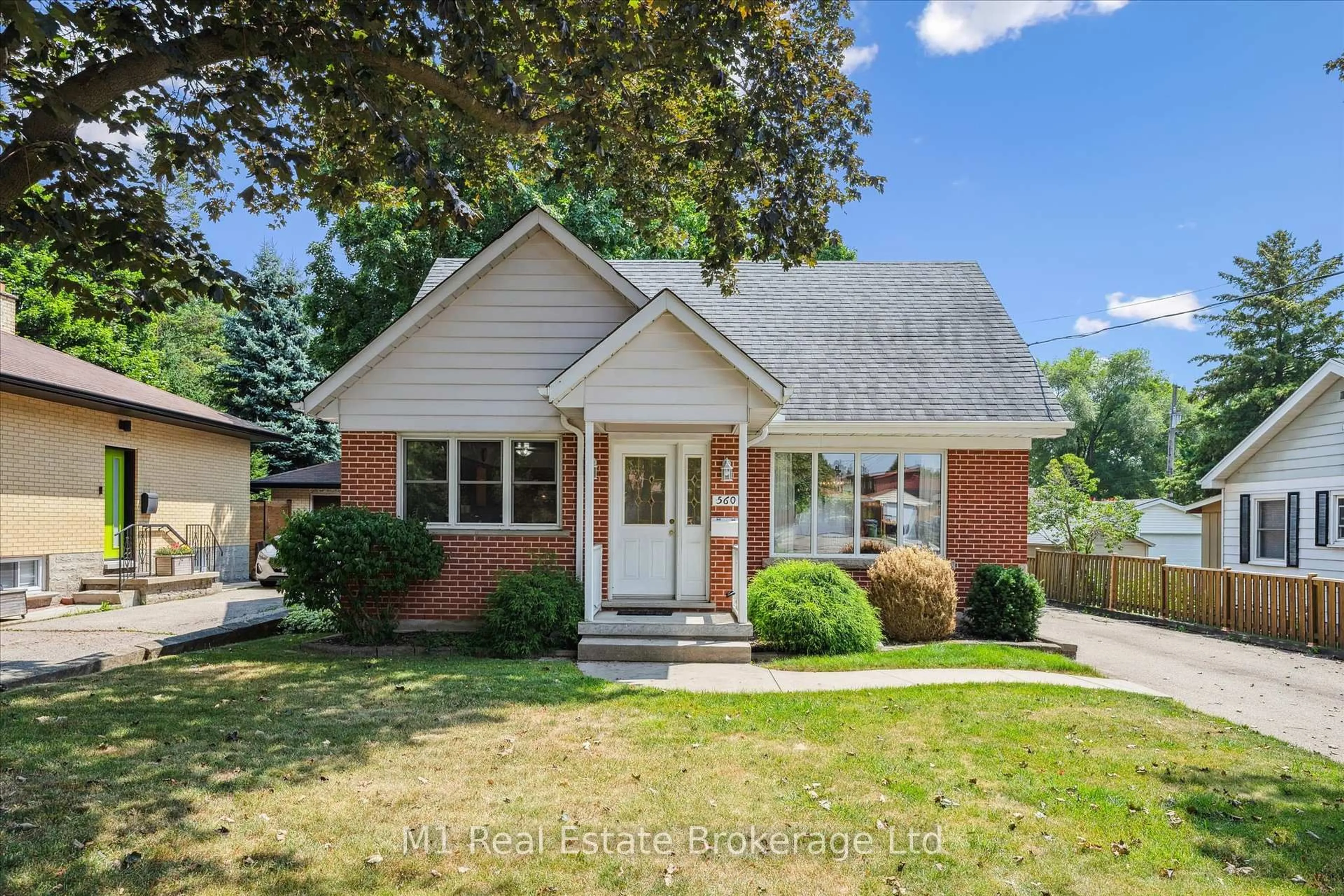 Home with brick exterior material, street for 560 Paisley Rd, Guelph Ontario N1H 2S1