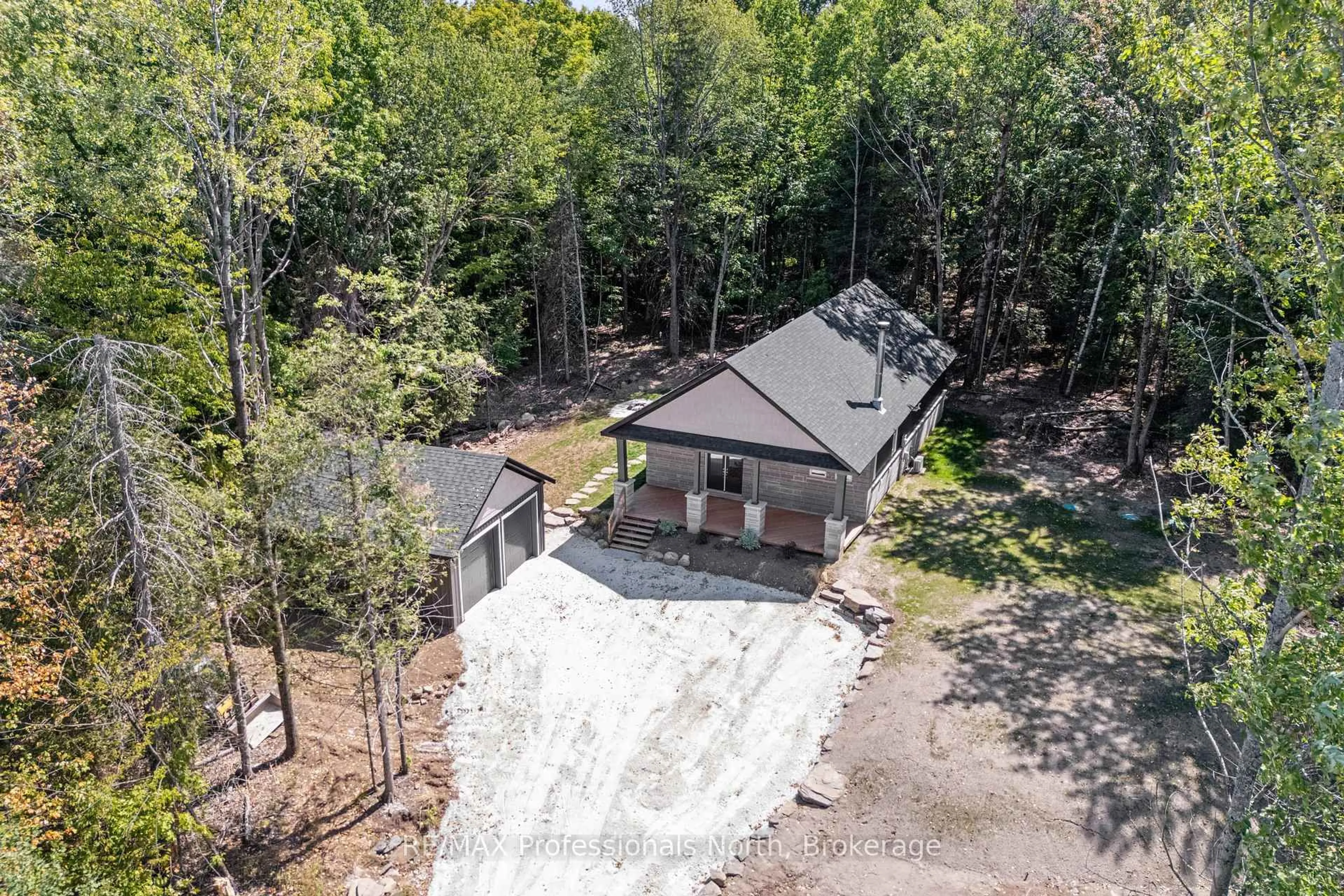 A pic from outside/outdoor area/front of a property/back of a property/a pic from drone, forest/trees view for 1076 Angel Rd, Dysart et al Ontario K0M 1S0