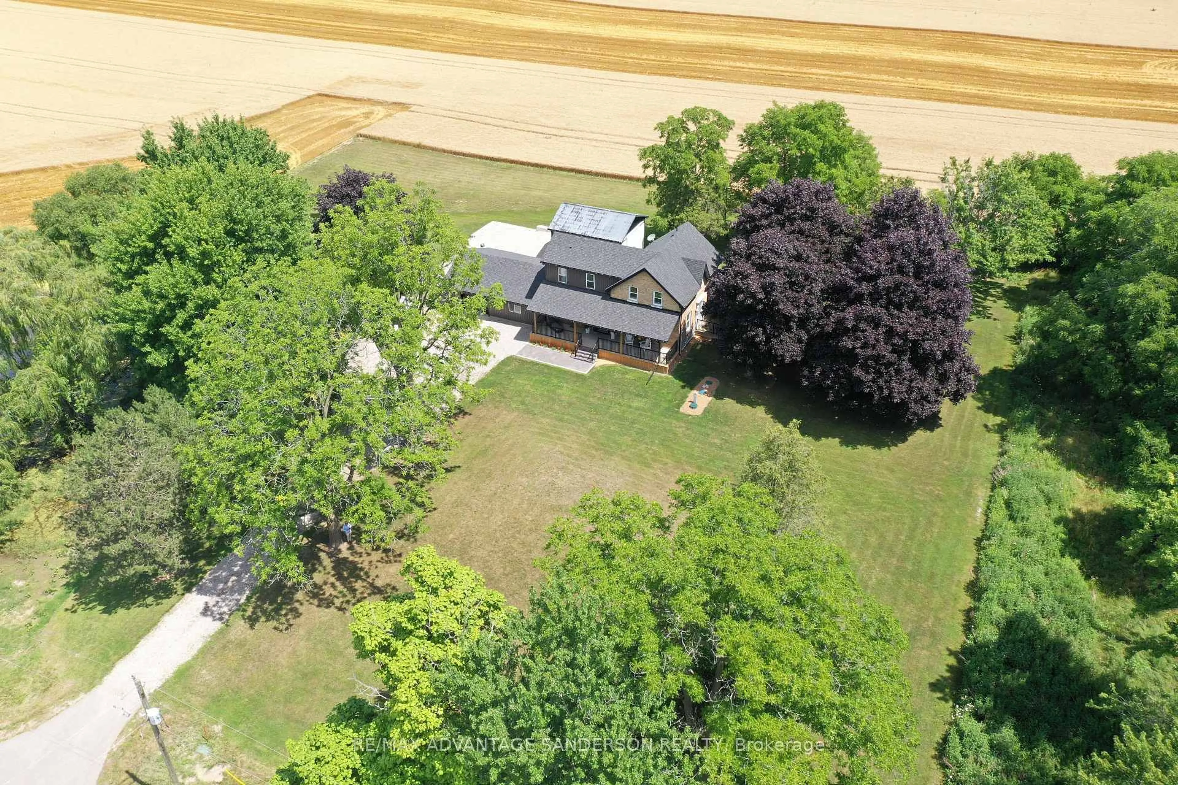 A pic from outside/outdoor area/front of a property/back of a property/a pic from drone, street for 22524 Vanneck Rd, Middlesex Centre Ontario N0M 2A0