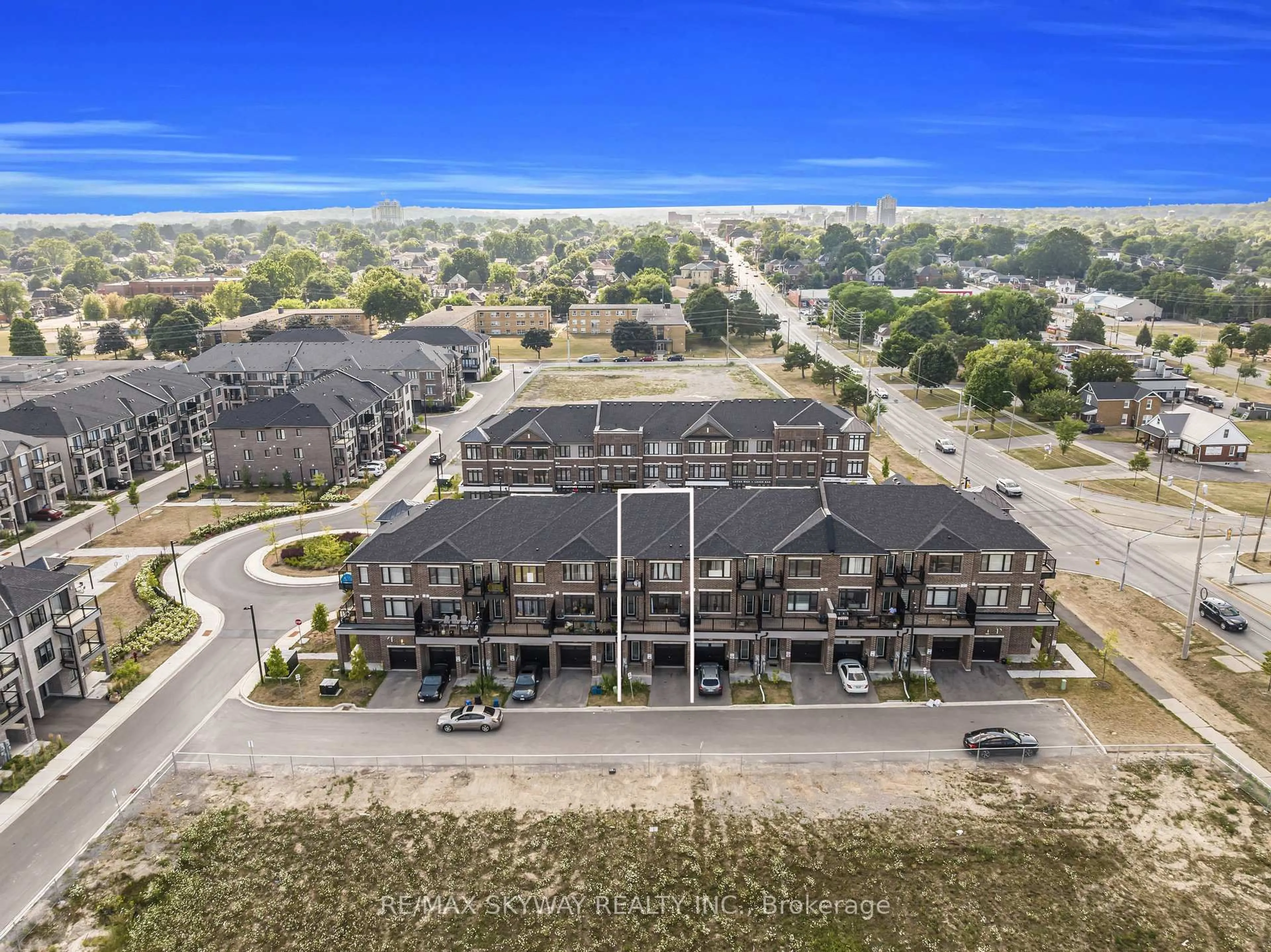 A pic from outside/outdoor area/front of a property/back of a property/a pic from drone, unknown for 585 Colborne St #106, Brantford Ontario N3S 0K4
