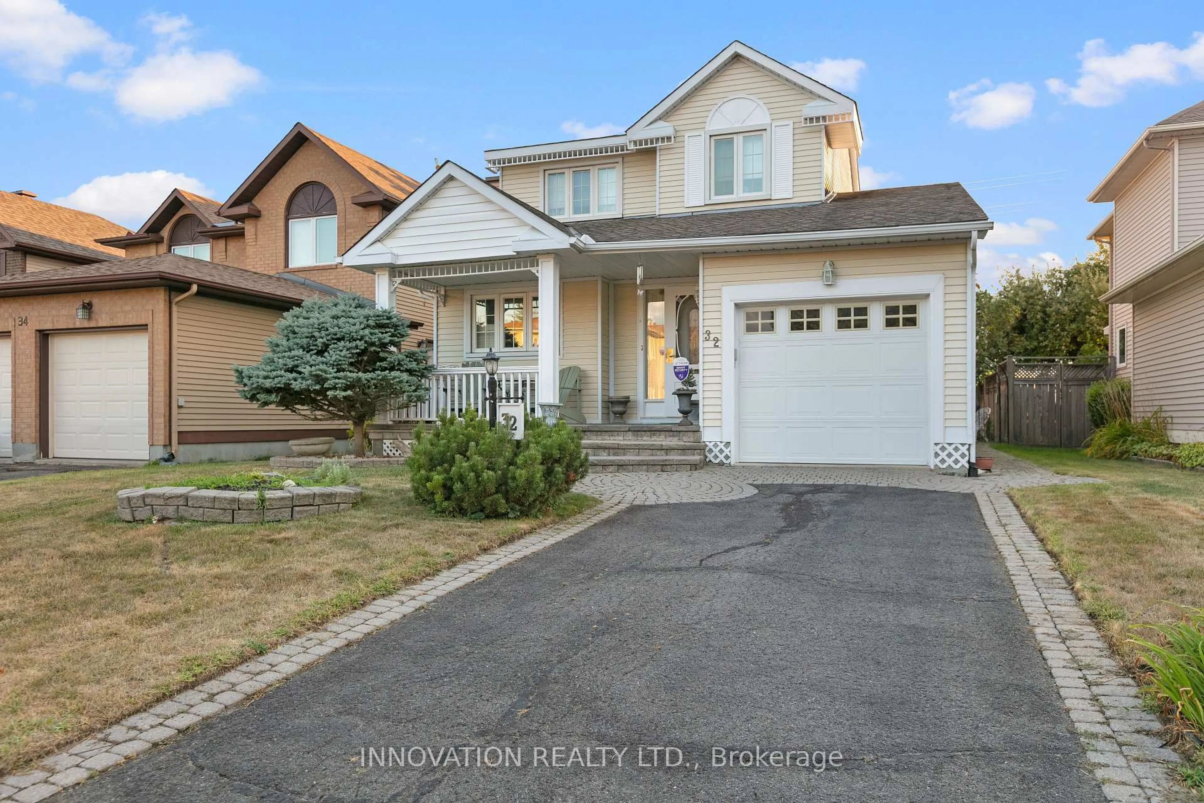 Home with vinyl exterior material, street for 32 Framingham Cres, Barrhaven Ontario K2J 3J8