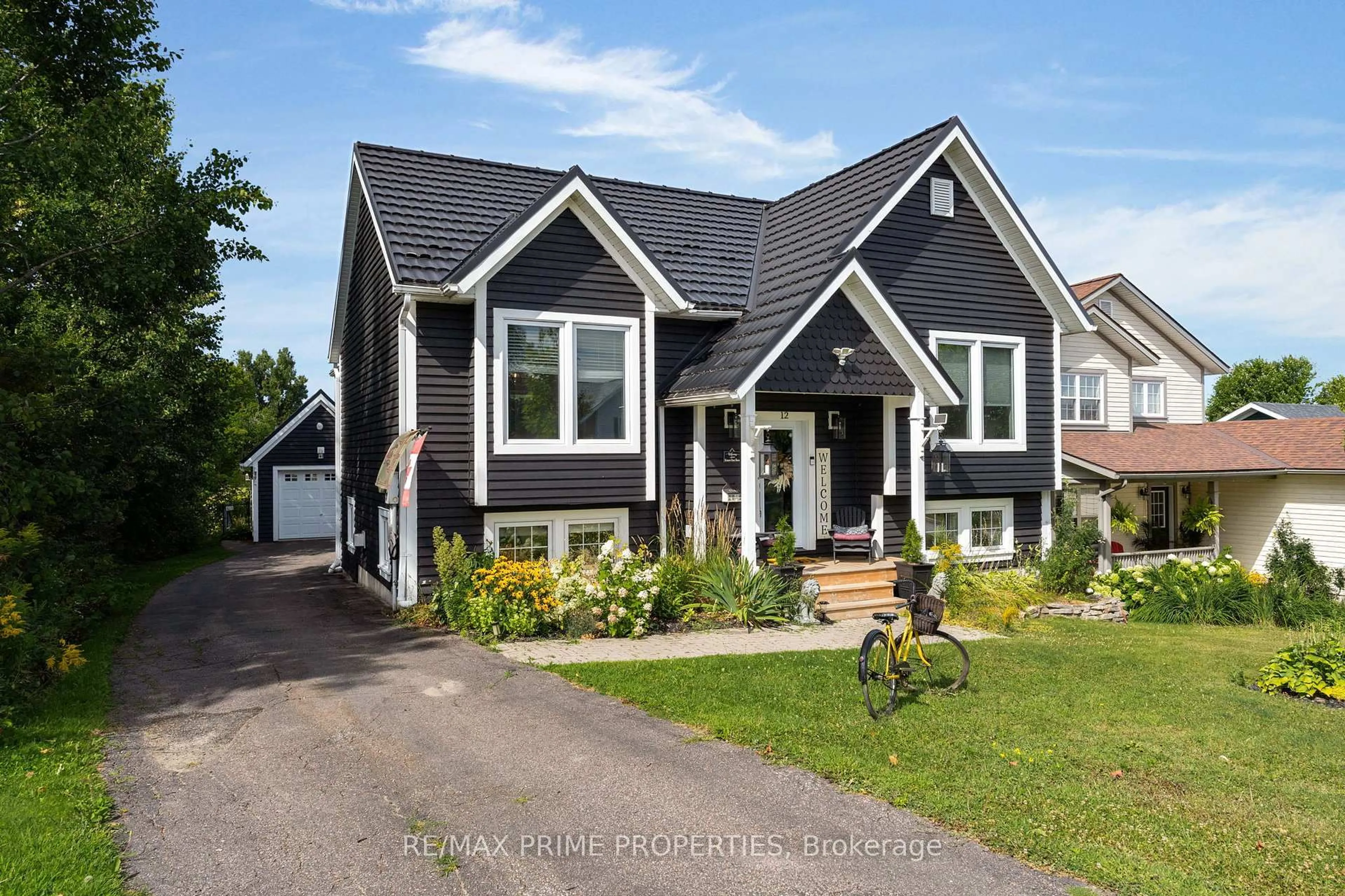 Home with vinyl exterior material, street for 12 Coates Ave, Bracebridge Ontario P1L 1Y5