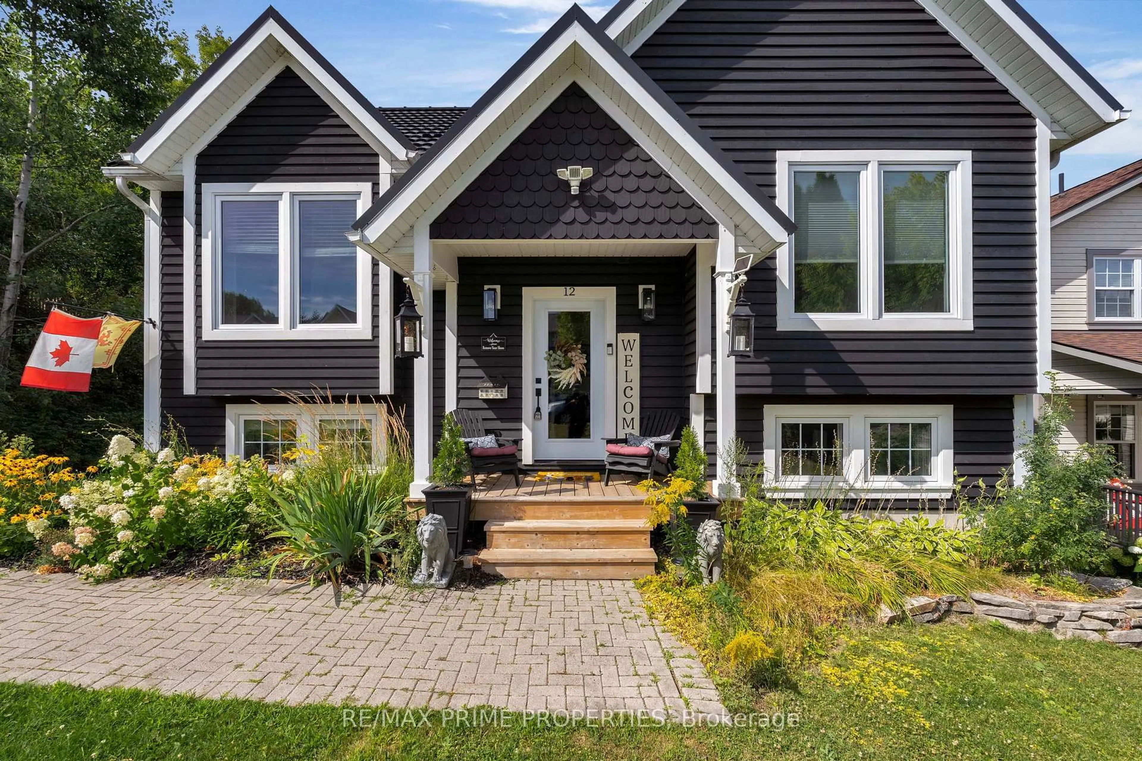 Home with vinyl exterior material, street for 12 Coates Ave, Bracebridge Ontario P1L 1Y5