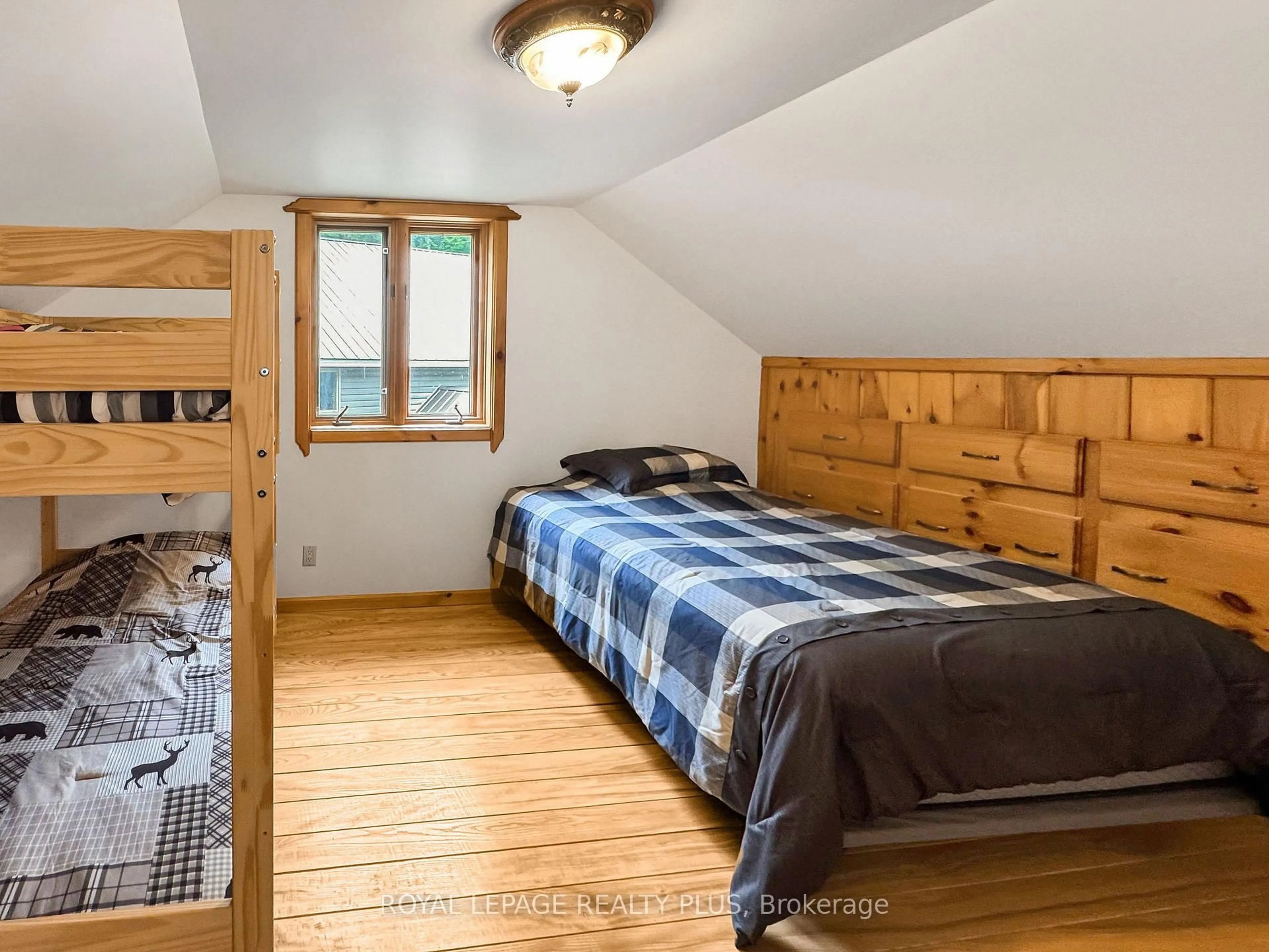 Bedroom with bed, wood/laminate floor for 203 Cottage Lane, Carlow/Mayo Ontario K0L 2M0
