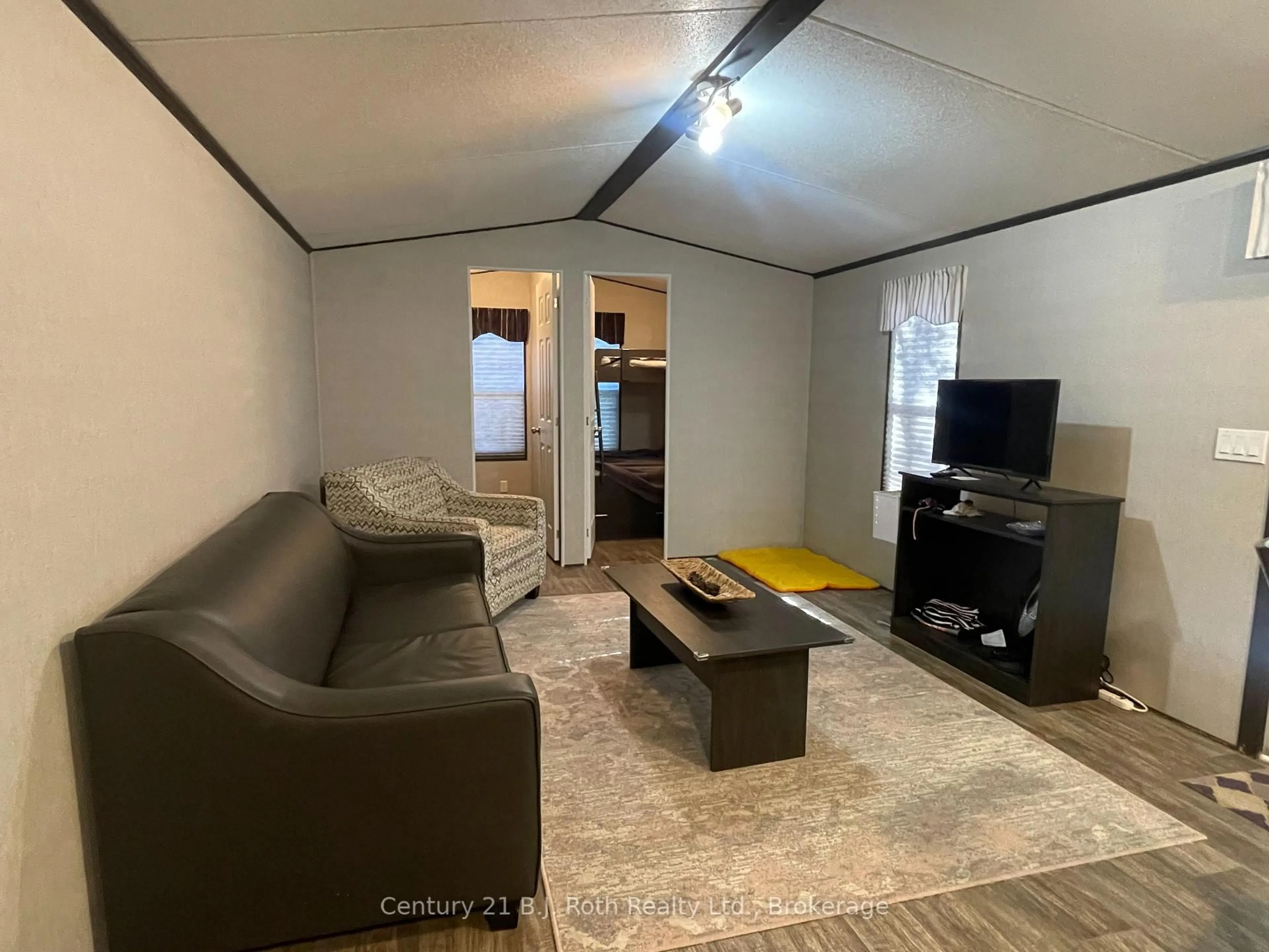 Living room with furniture, unknown for 1047 Bonnie Lake Camp Rd #804, Bracebridge Ontario P1L 1L9
