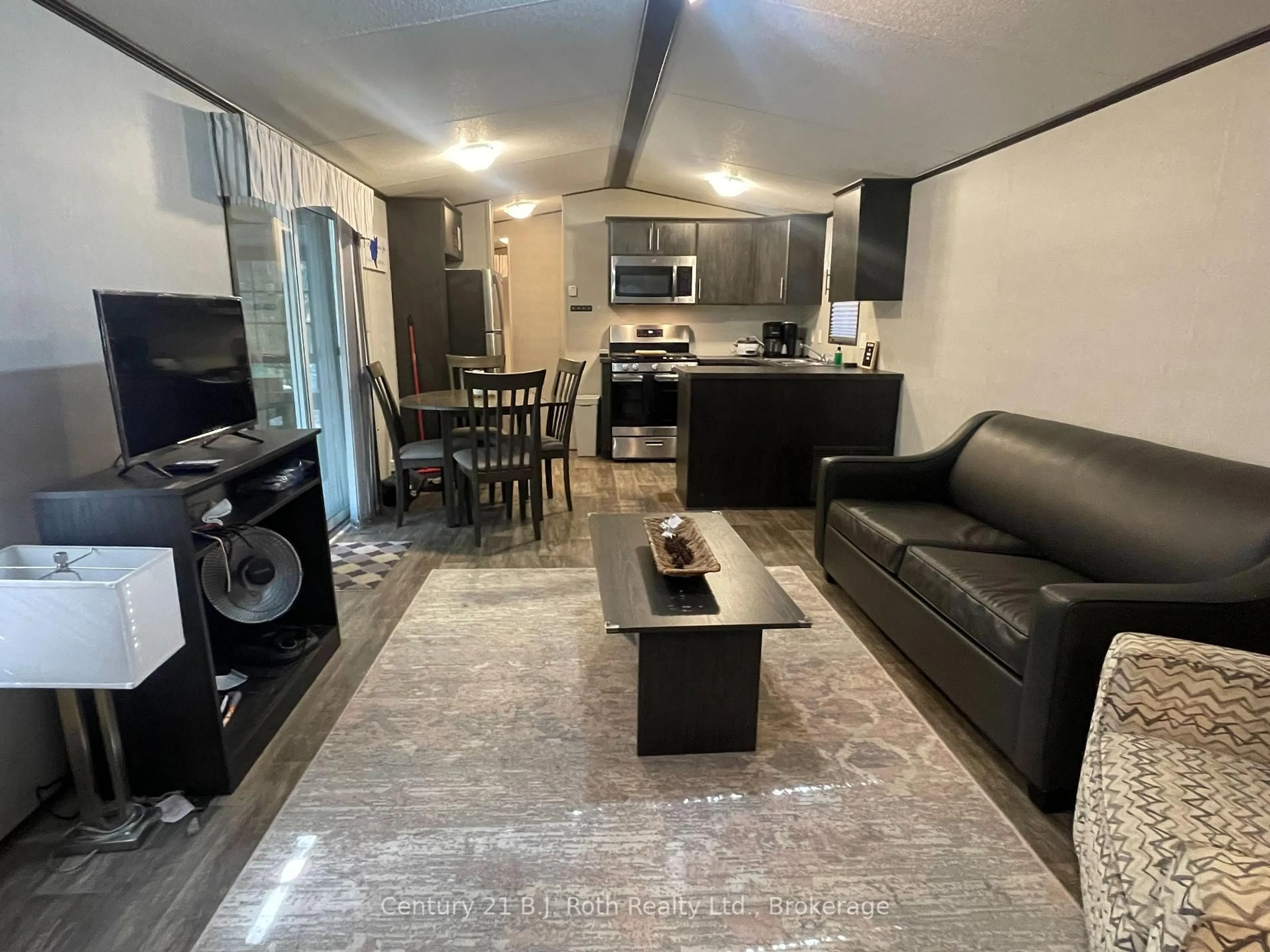 Living room with furniture, unknown for 1047 Bonnie Lake Camp Rd #804, Bracebridge Ontario P1L 1L9