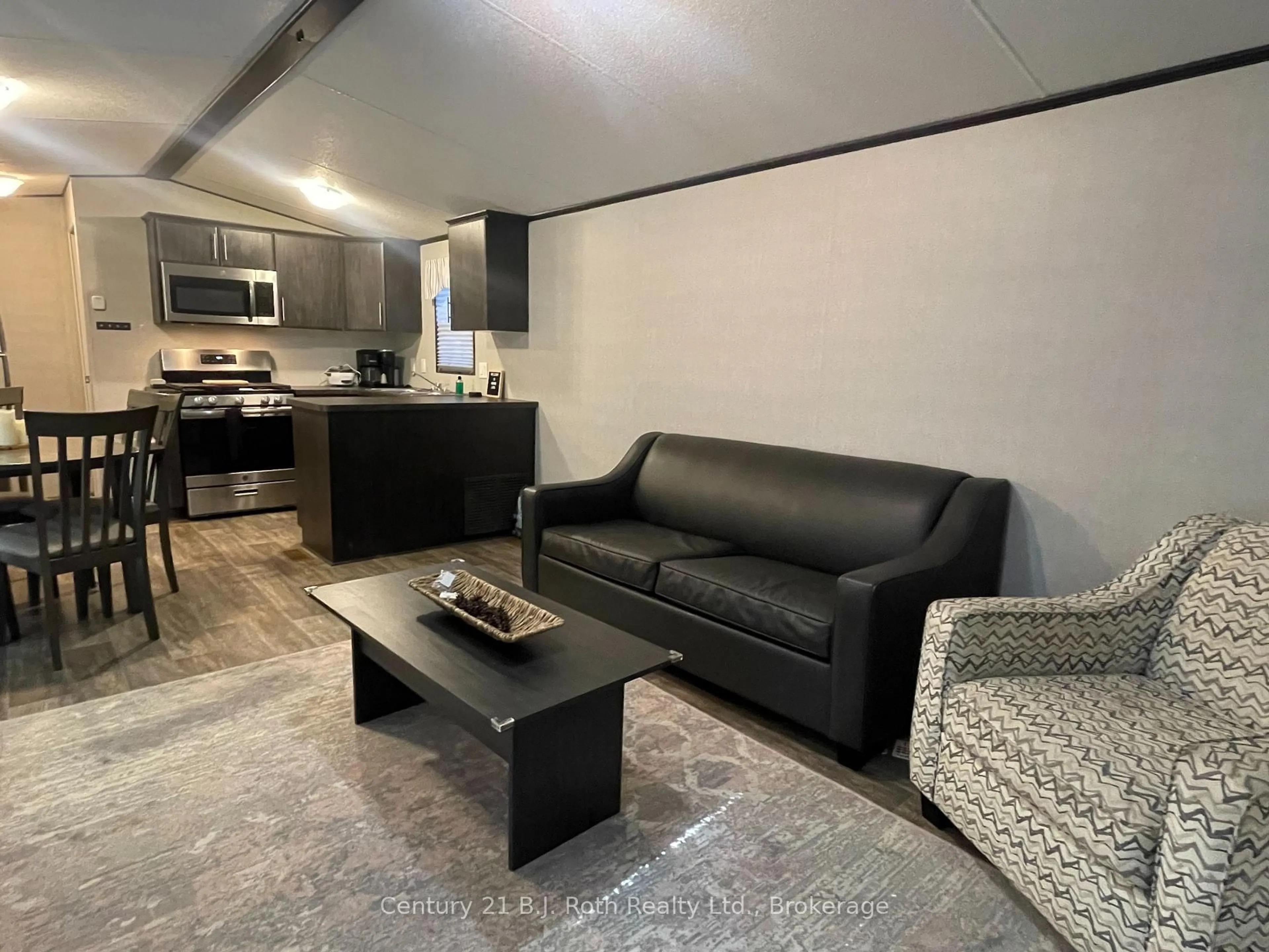 Living room with furniture, unknown for 1047 Bonnie Lake Camp Rd #804, Bracebridge Ontario P1L 1L9