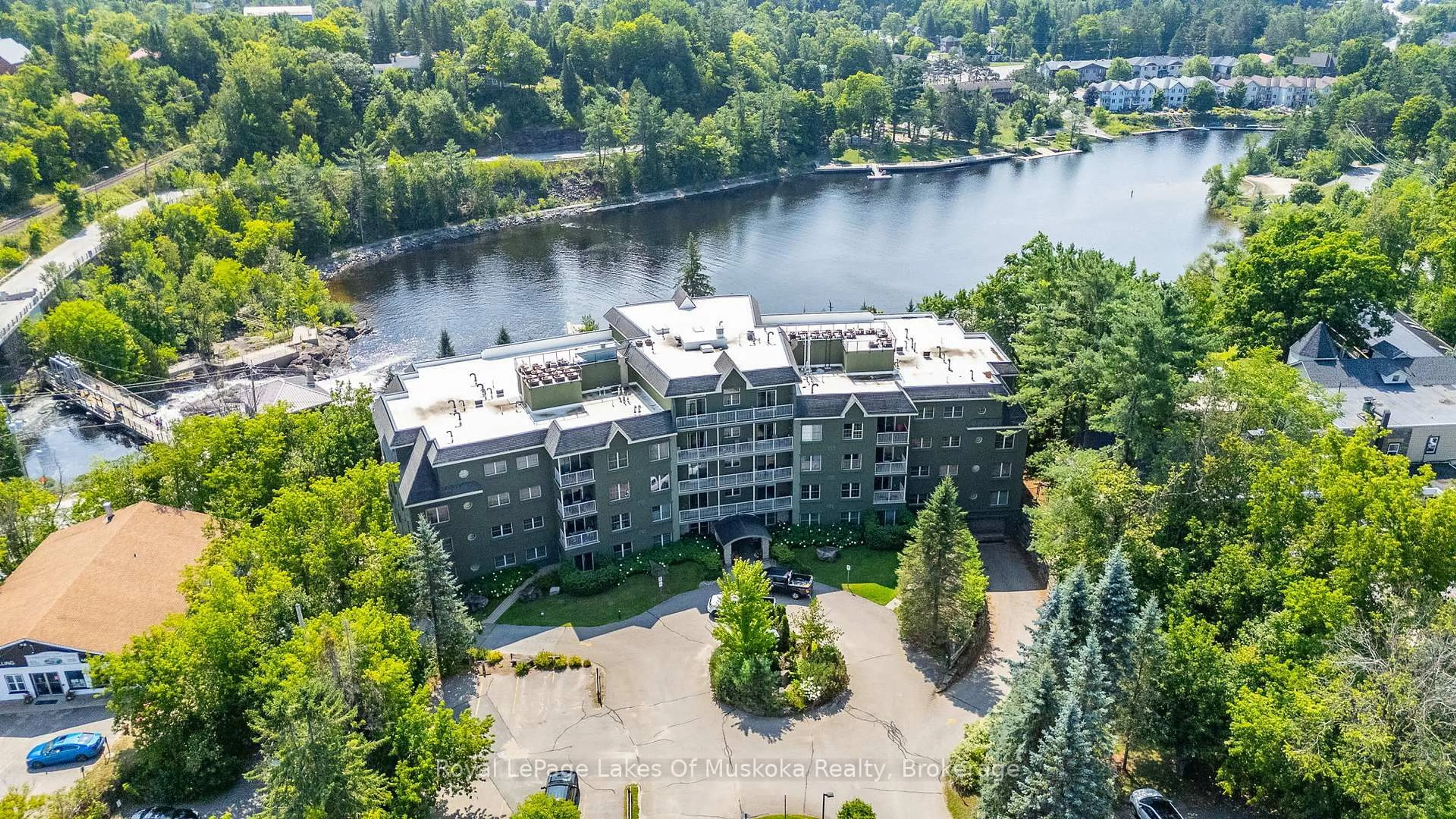 A pic from outside/outdoor area/front of a property/back of a property/a pic from drone, water/lake/river/ocean view for 24 Ontario St #308, Bracebridge Ontario P1L 2H5