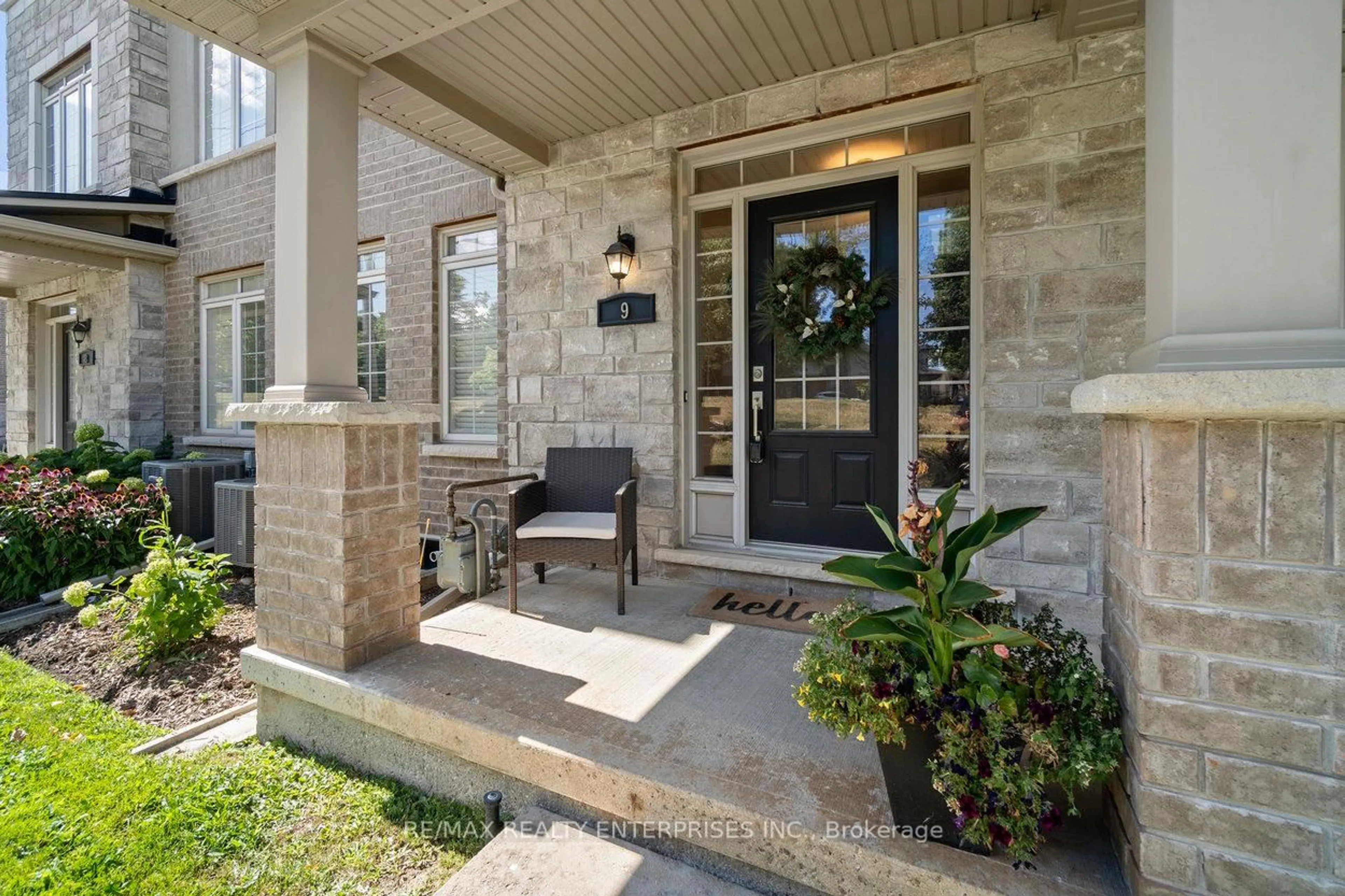 Home with brick exterior material, street for 215 Dundas St #9, Hamilton Ontario L8B 0X2