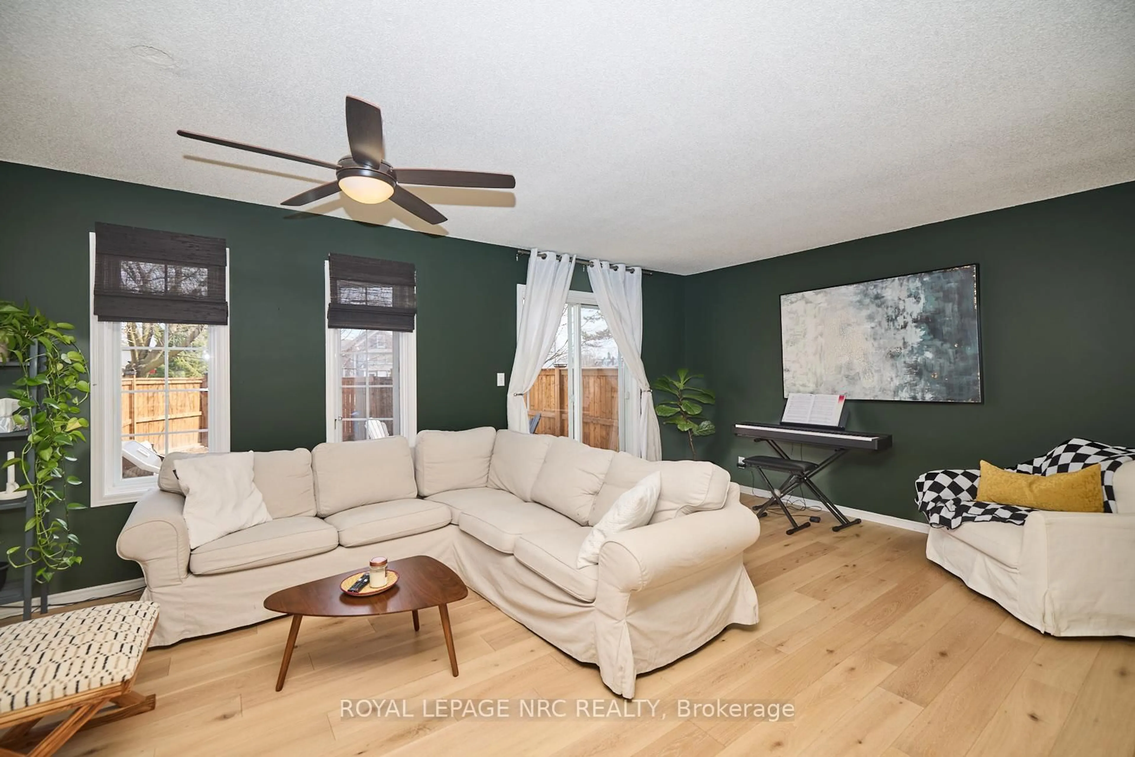 Living room with furniture, wood/laminate floor for 133C Martindale Rd, St. Catharines Ontario L2S 2X5