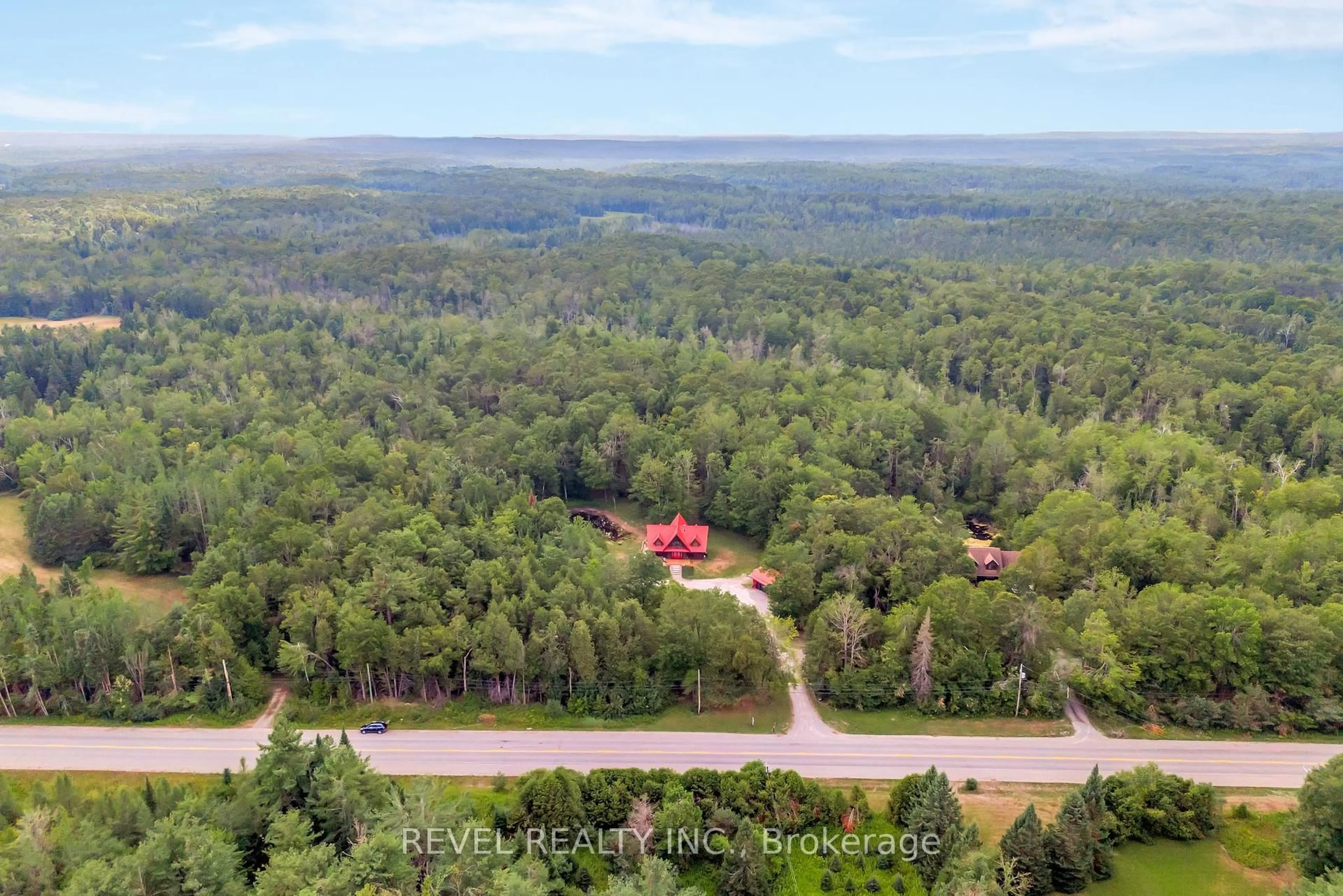 A pic from outside/outdoor area/front of a property/back of a property/a pic from drone, forest/trees view for 3515 County Rd 121 Rd, Kawartha Lakes Ontario K0M 2A0