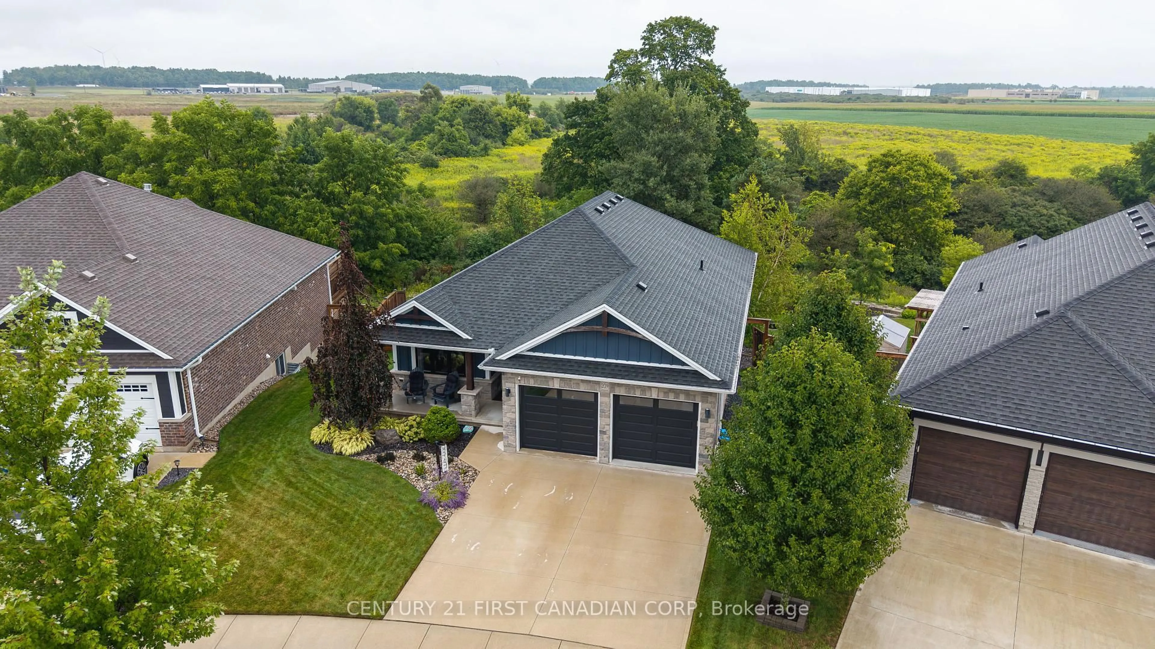 A pic from outside/outdoor area/front of a property/back of a property/a pic from drone, water/lake/river/ocean view for 209 Everett Lane, Strathroy-Caradoc Ontario N7G 0E7