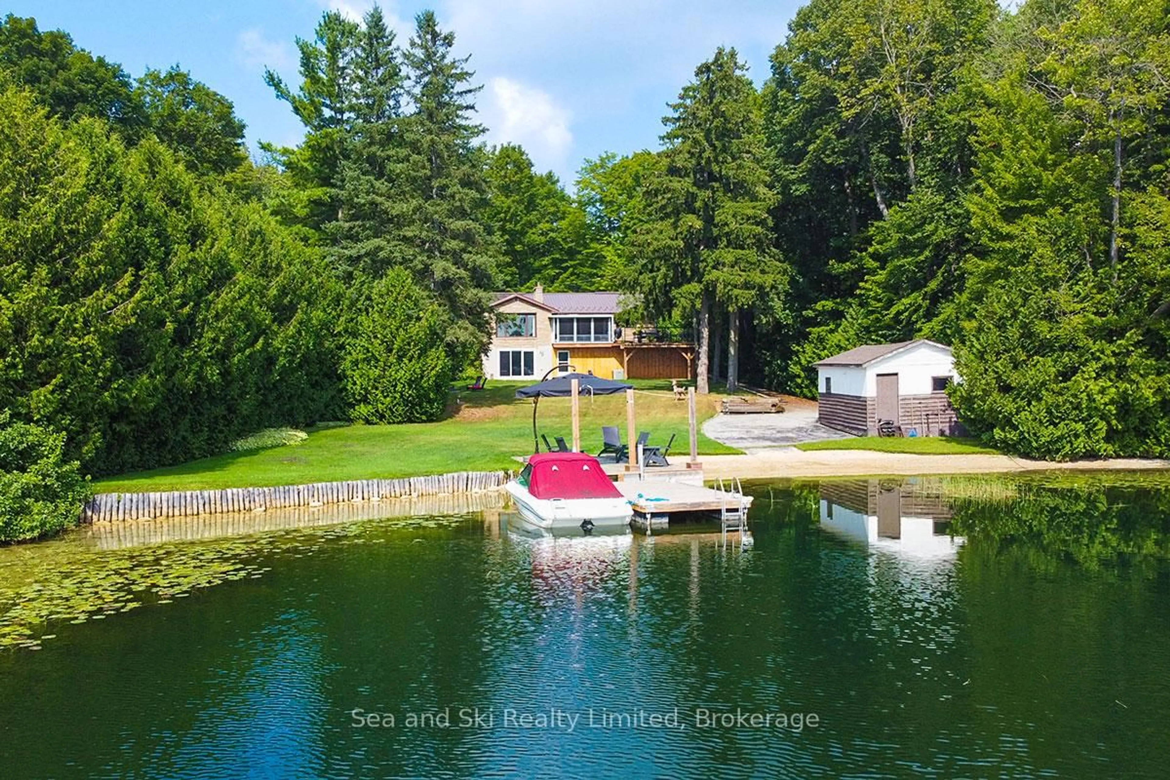 A pic from outside/outdoor area/front of a property/back of a property/a pic from drone, water/lake/river/ocean view for 102 Mccullough Lake Dr, Chatsworth Ontario N0H 2V0