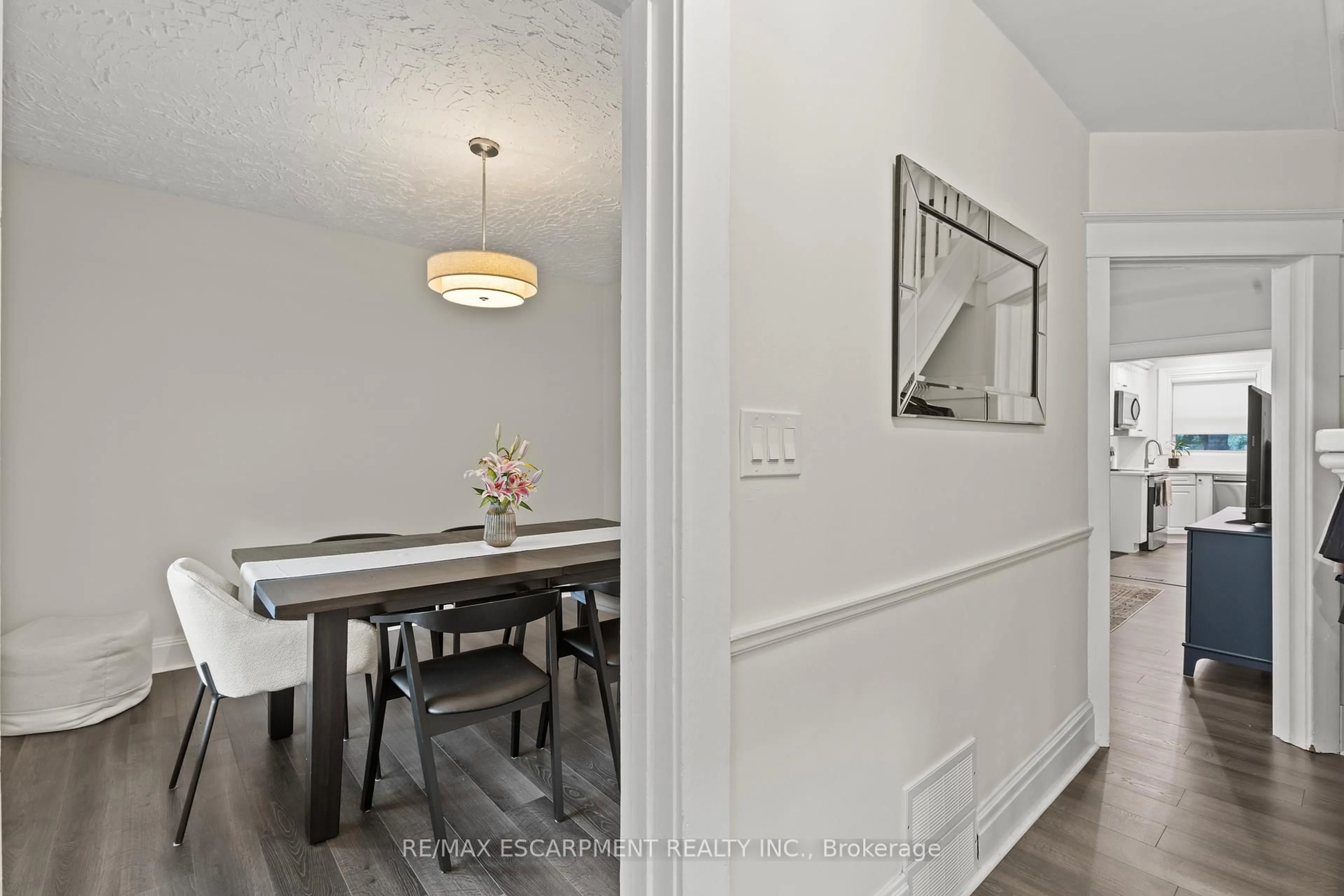 Dining room, wood/laminate floor for 32 Webber Ave, Hamilton Ontario L8N 1W3