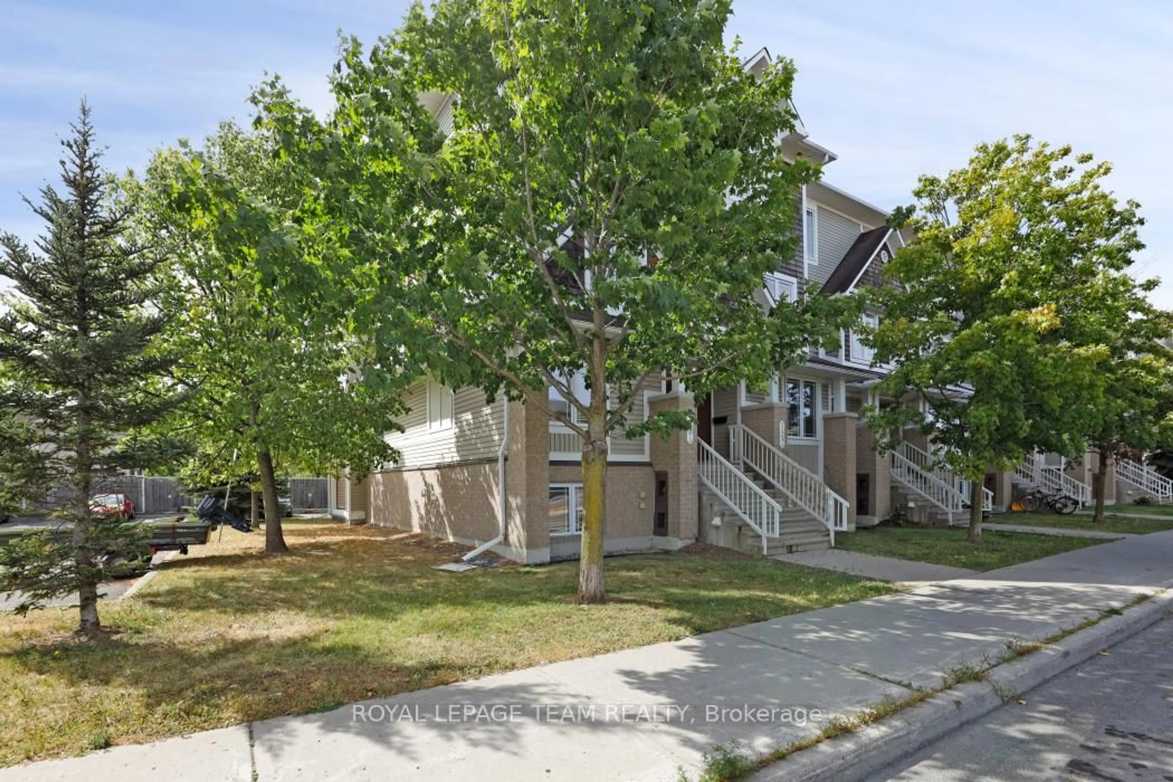 A pic from outside/outdoor area/front of a property/back of a property/a pic from drone, street for 560 Chapman Mills Dr #A, Ottawa Ontario K2J 3V2