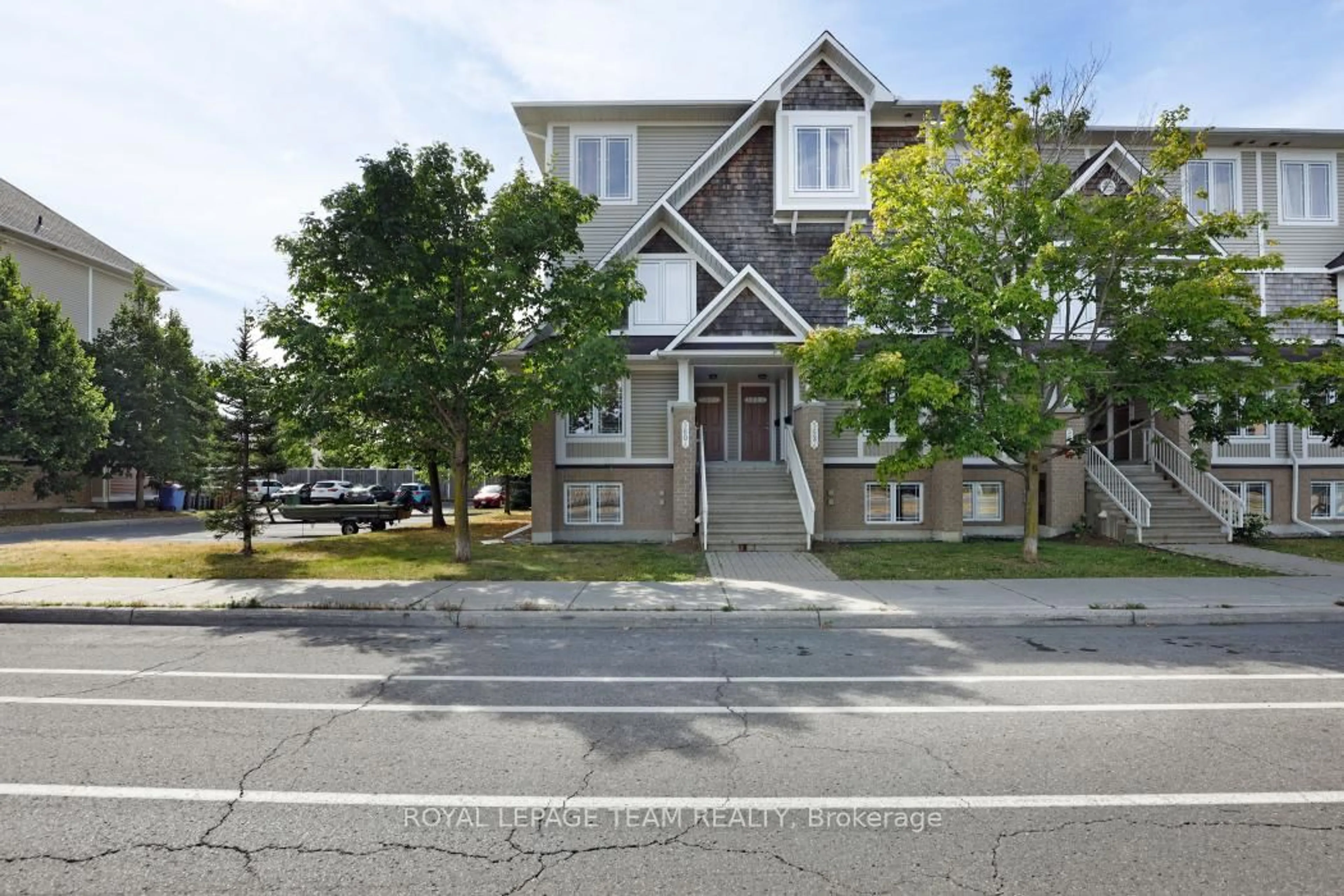 A pic from outside/outdoor area/front of a property/back of a property/a pic from drone, street for 560 Chapman Mills Dr #A, Ottawa Ontario K2J 3V2