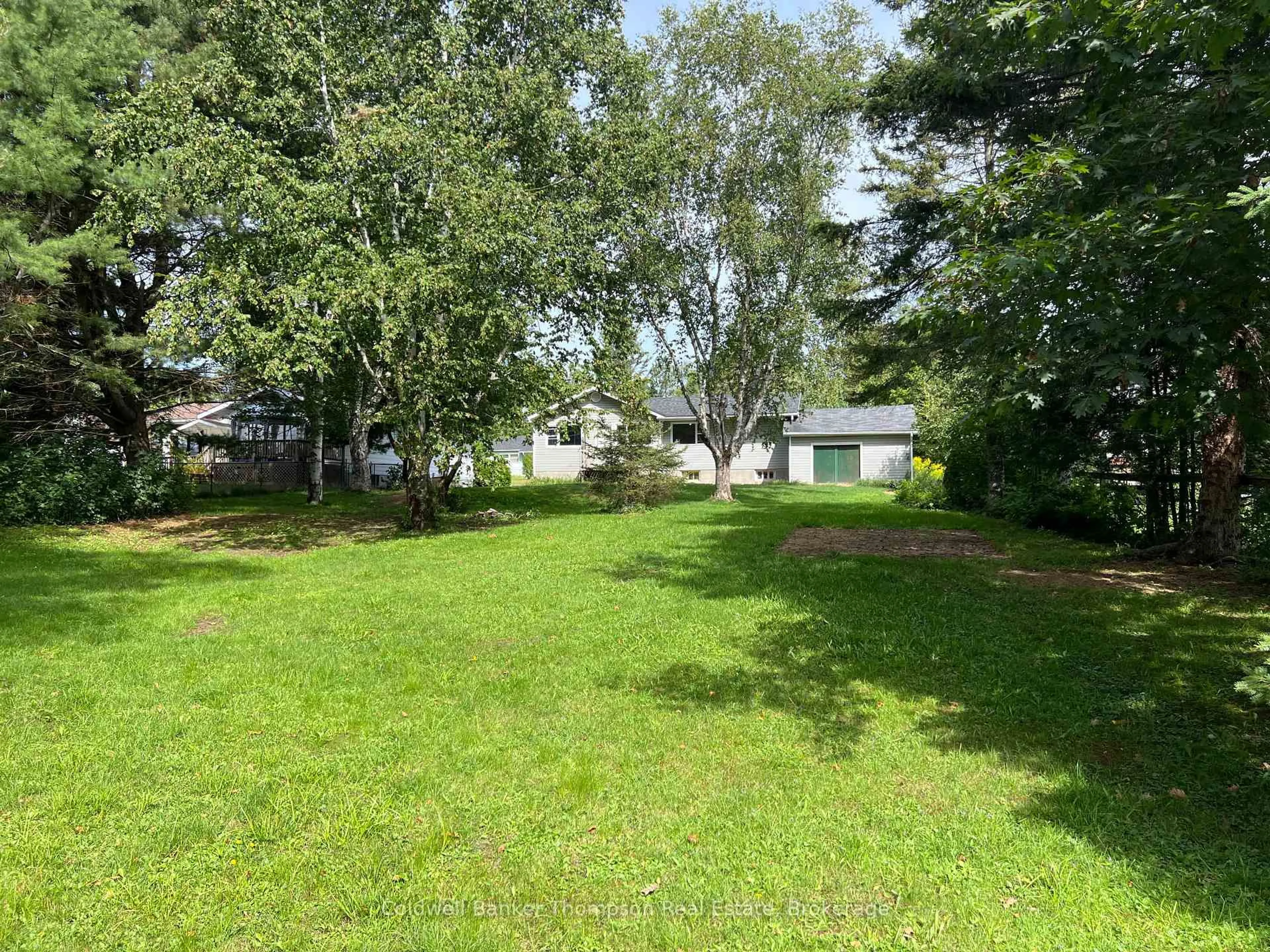 A pic from outside/outdoor area/front of a property/back of a property/a pic from drone, forest/trees view for 29 Queen St, Sundridge Ontario P0A 1Z0