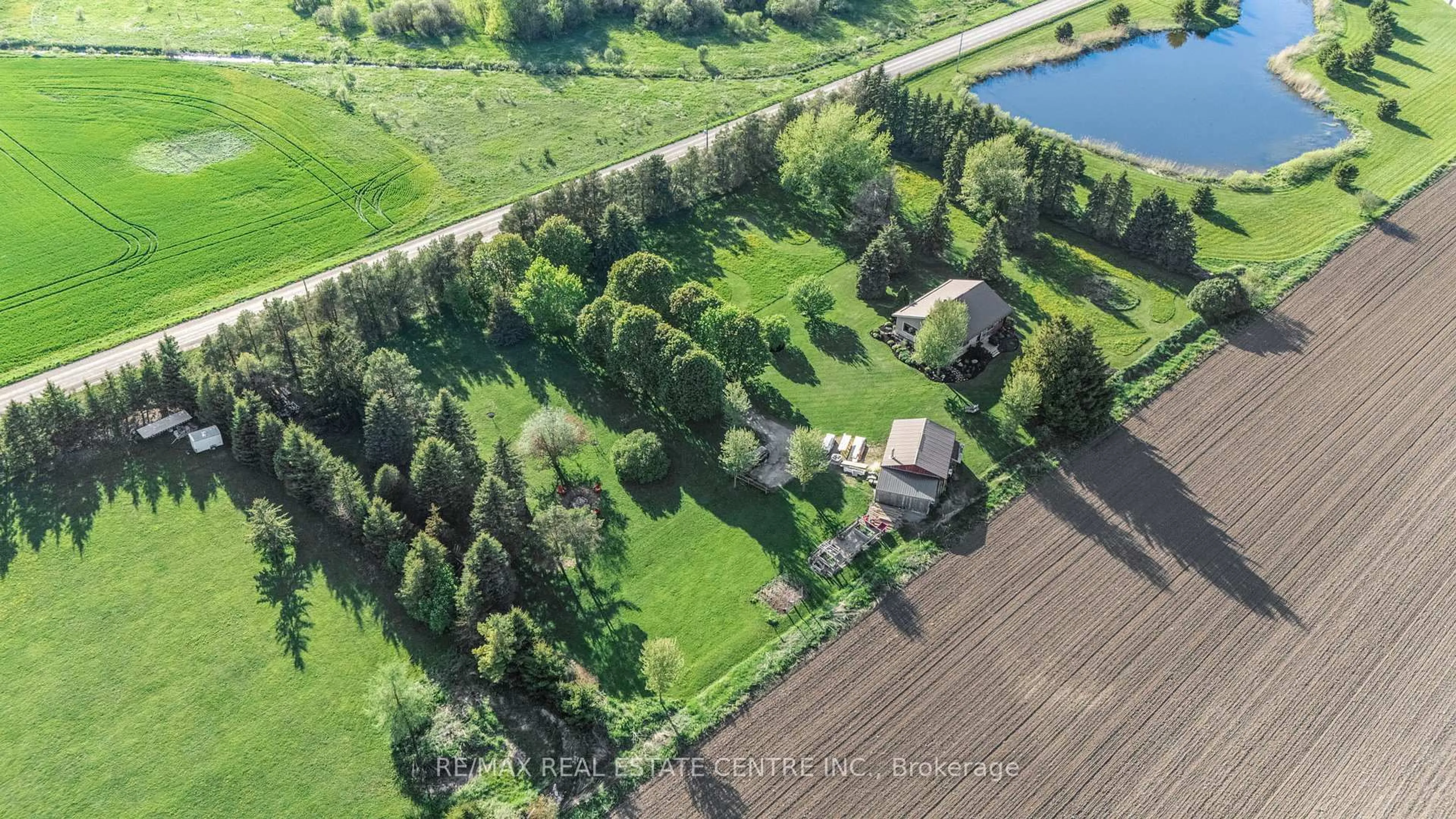 A pic from outside/outdoor area/front of a property/back of a property/a pic from drone, water/lake/river/ocean view for 74019 24 - 25 Sdrd, East Luther Grand Valley Ontario L9W 0J3