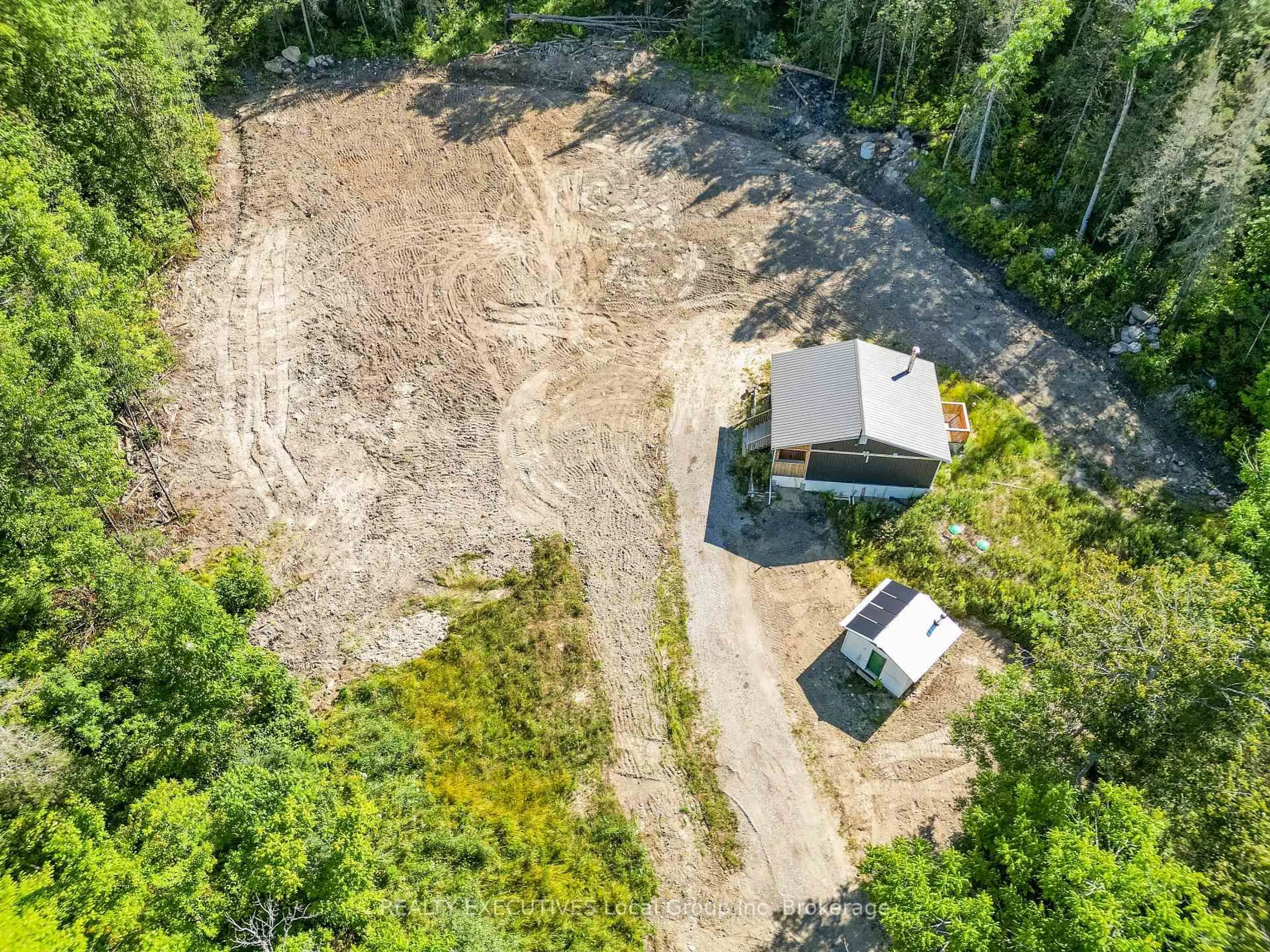 A pic from outside/outdoor area/front of a property/back of a property/a pic from drone, forest/trees view for 1348 Peddlers Dr, Calvin Ontario P0H 1V0