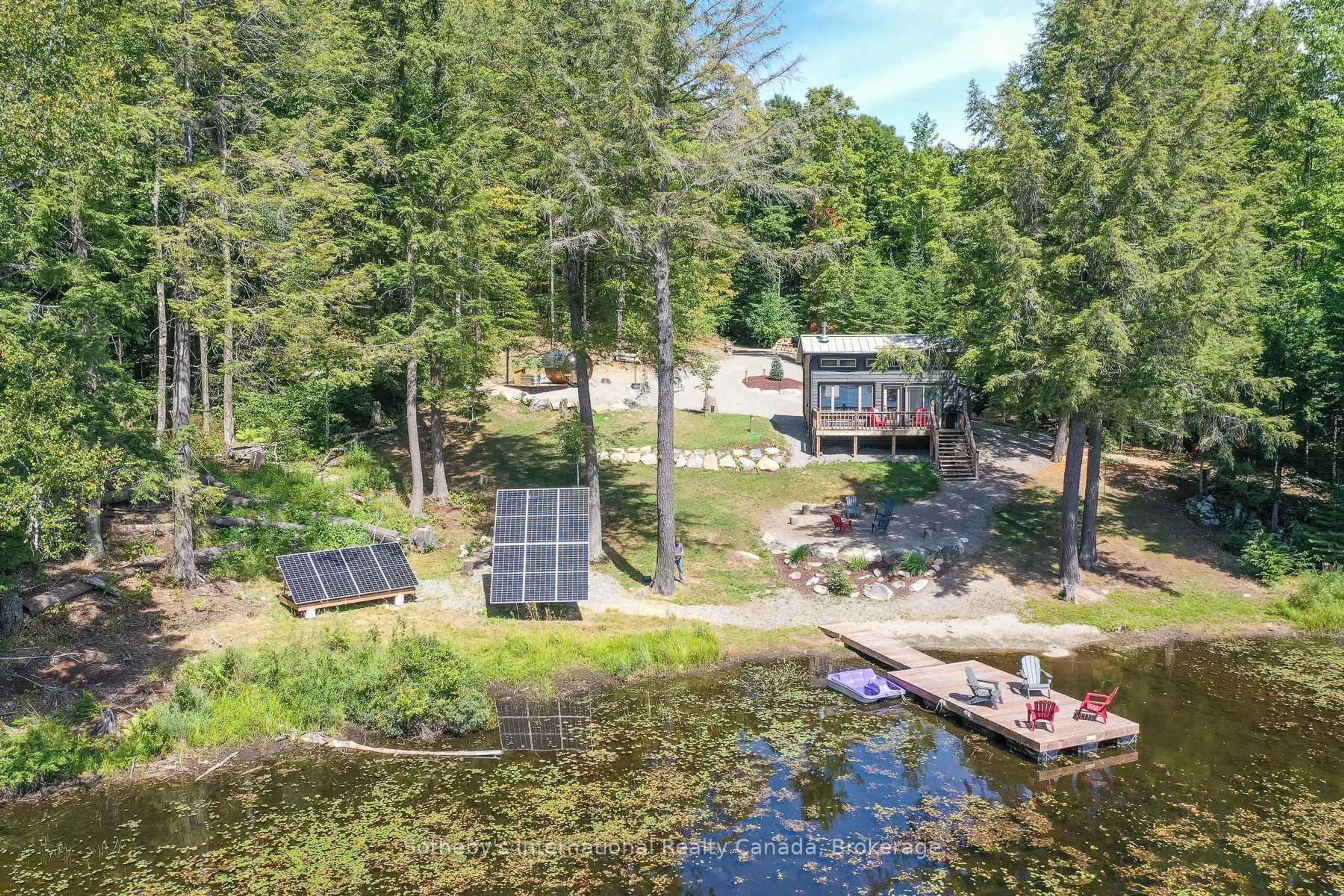 A pic from outside/outdoor area/front of a property/back of a property/a pic from drone, water/lake/river/ocean view for 1211 Pluto Tr, Dysart et al Ontario K0M 1S0