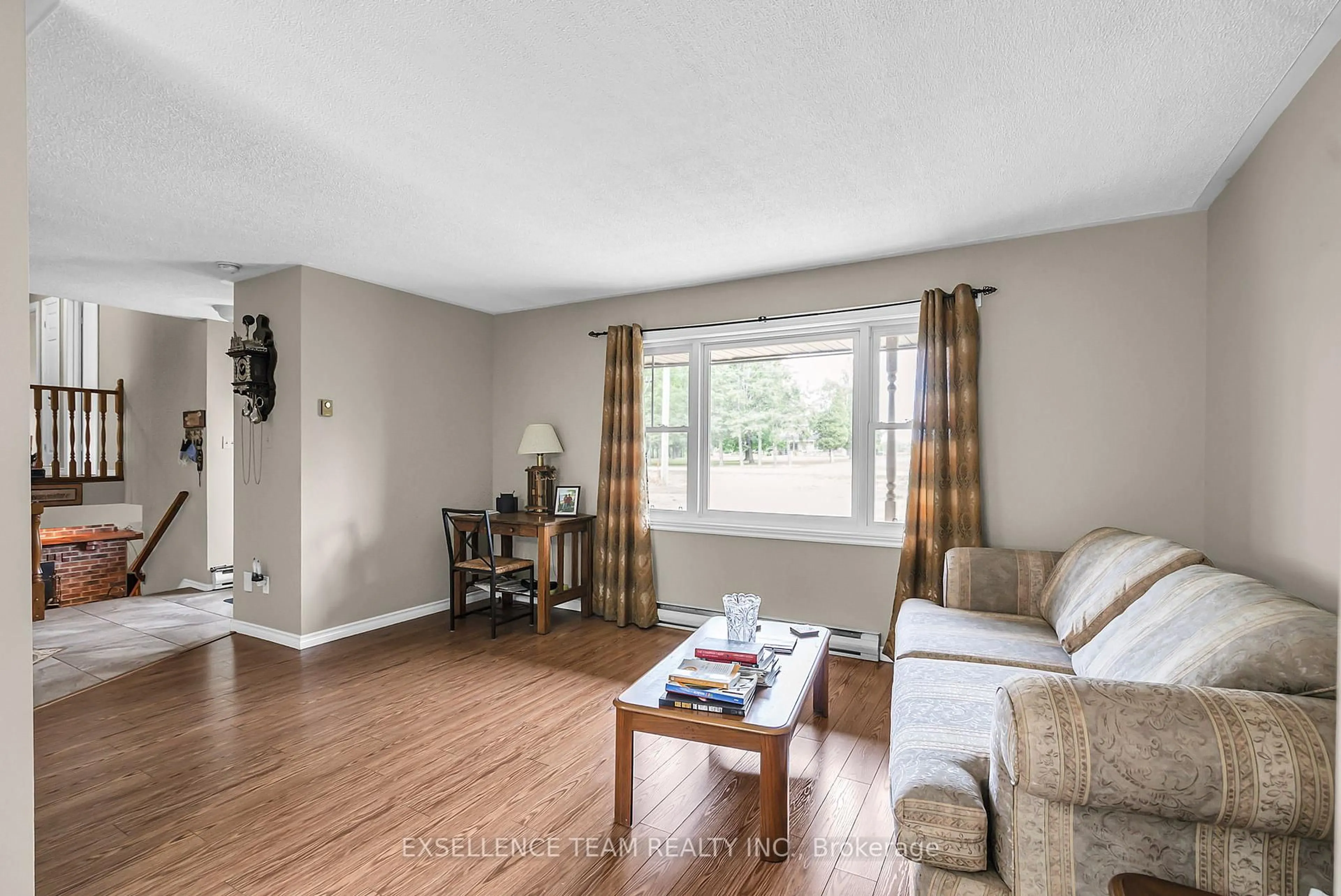 Living room with furniture, wood/laminate floor for 18537 Glen Rd, South Glengarry Ontario K0C 2J0