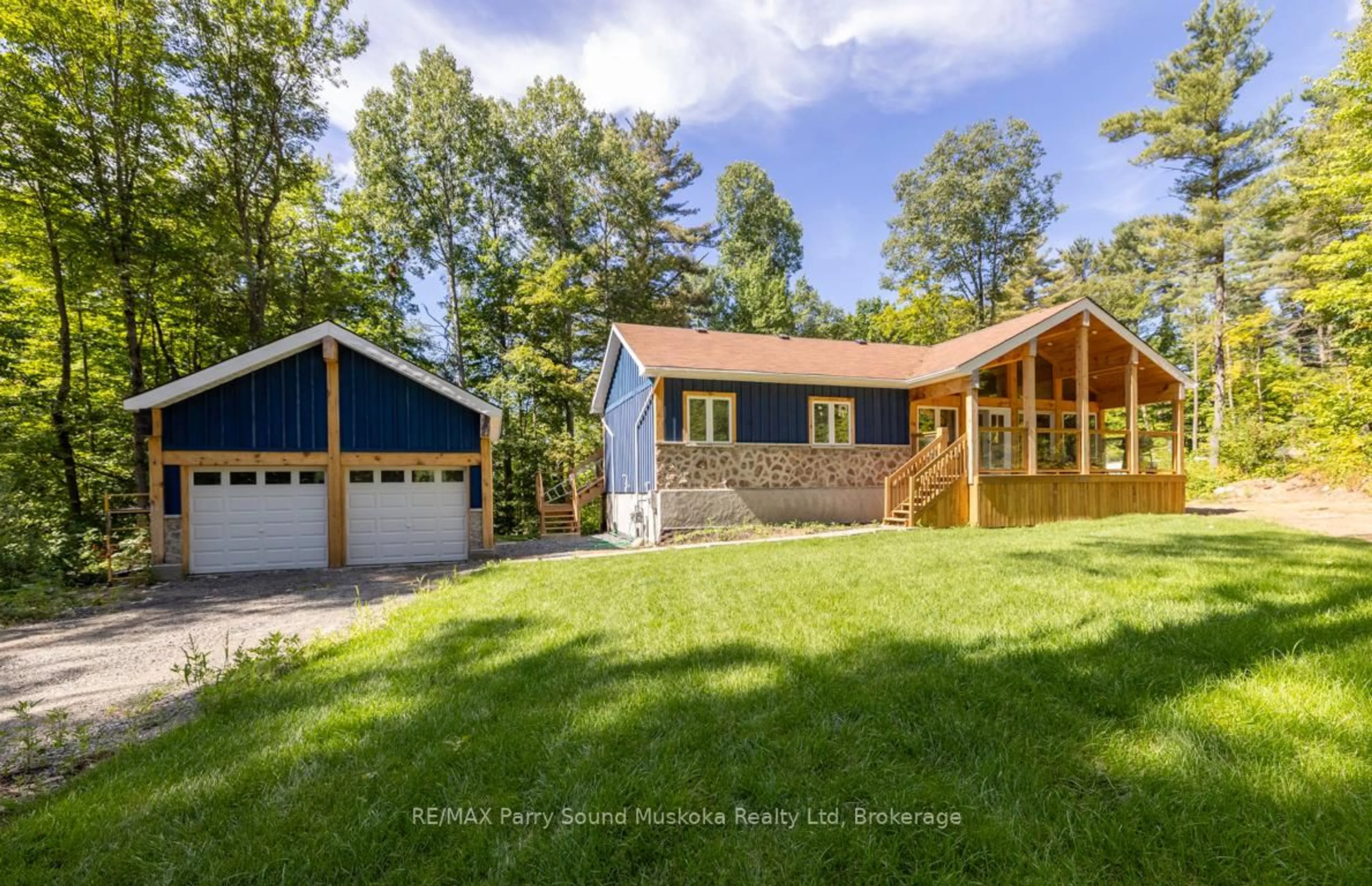 A pic from outside/outdoor area/front of a property/back of a property/a pic from drone, water/lake/river/ocean view for 15 Rankin Lake Rd, Seguin Ontario P2A 0B2