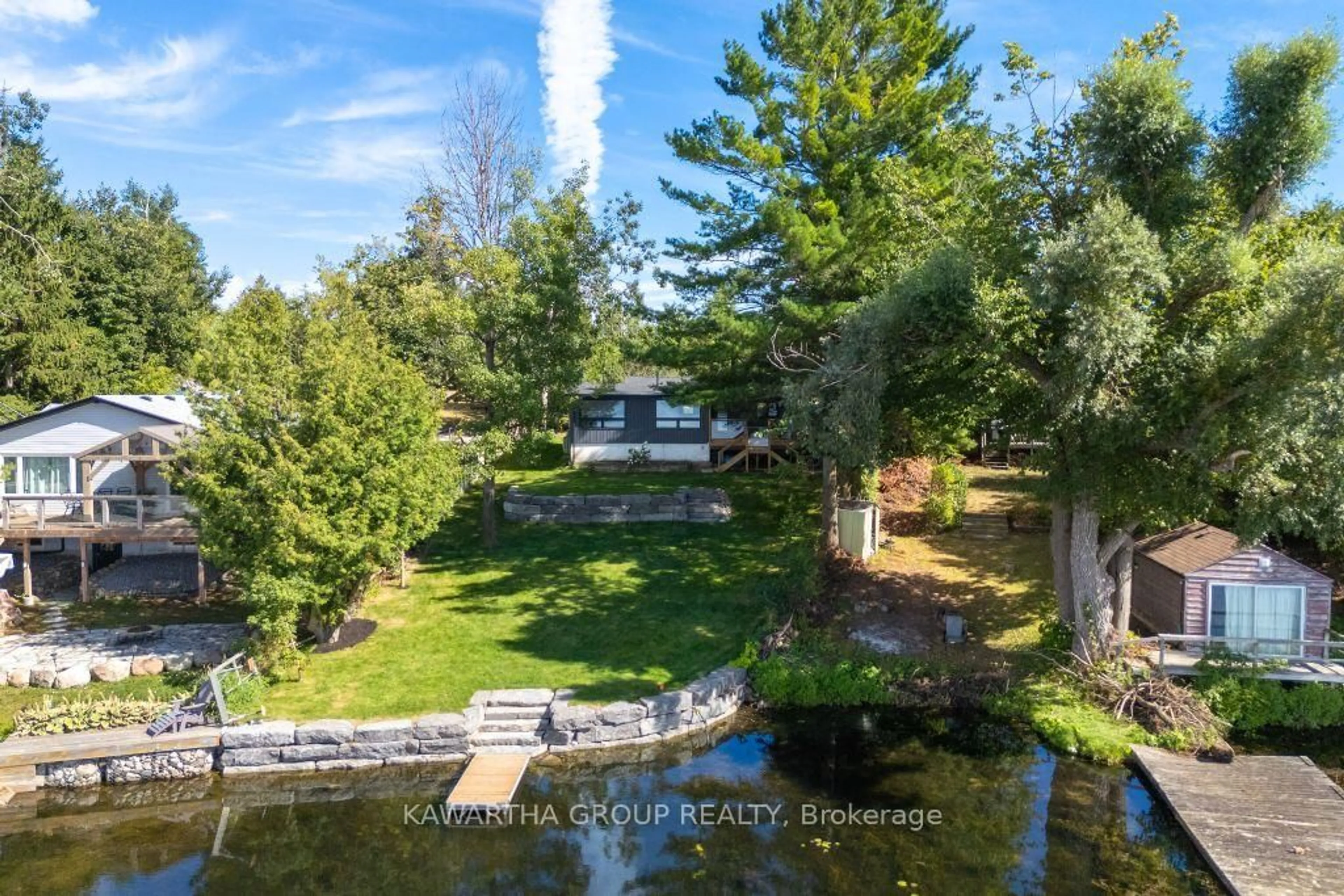 A pic from outside/outdoor area/front of a property/back of a property/a pic from drone, water/lake/river/ocean view for 77 North Taylor Rd, Kawartha Lakes Ontario K0M 2B0