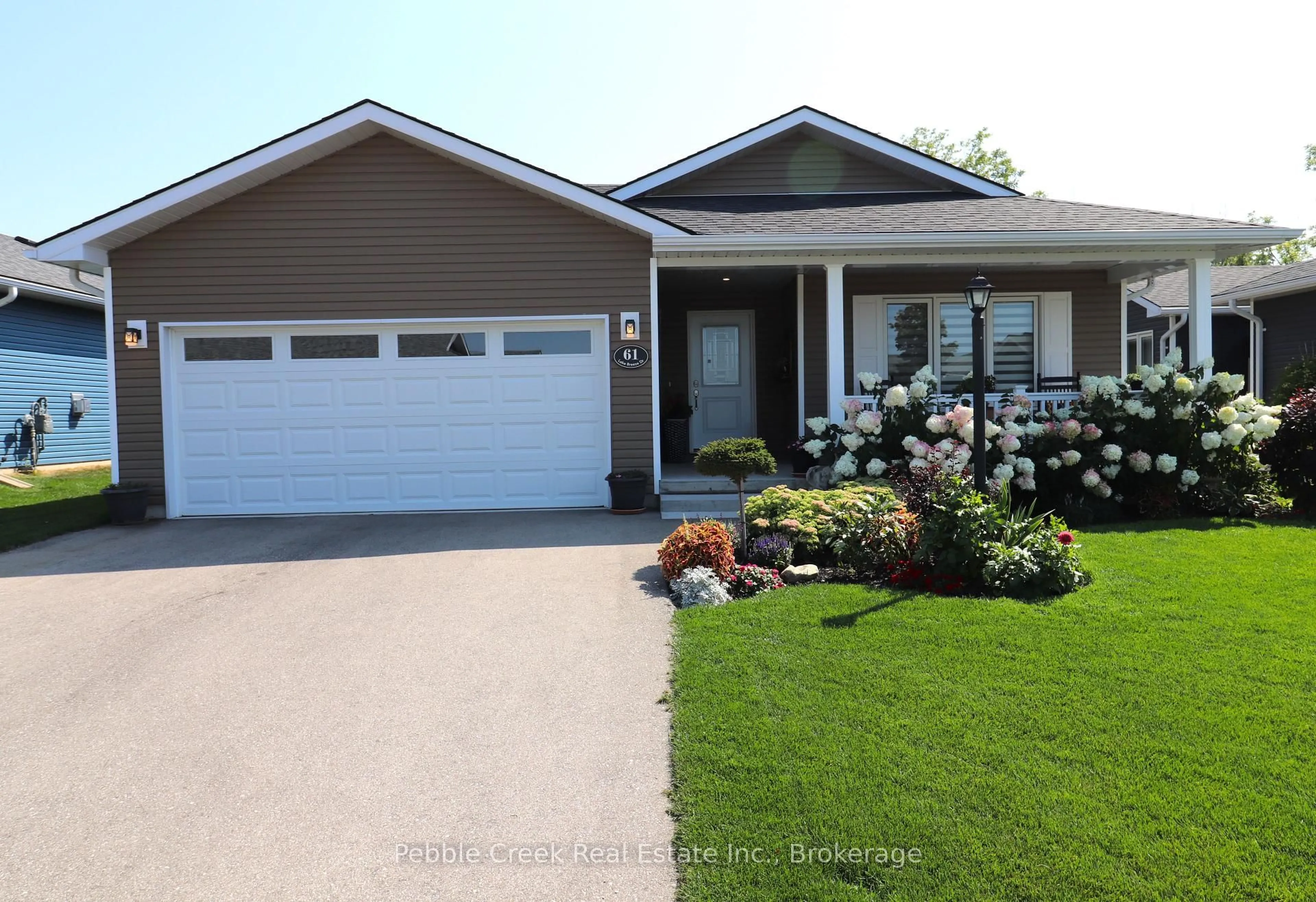 Home with vinyl exterior material, street for 61 Lake Breeze Dr, Ashfield-Colborne-Wawanosh Ontario N7A 0B8