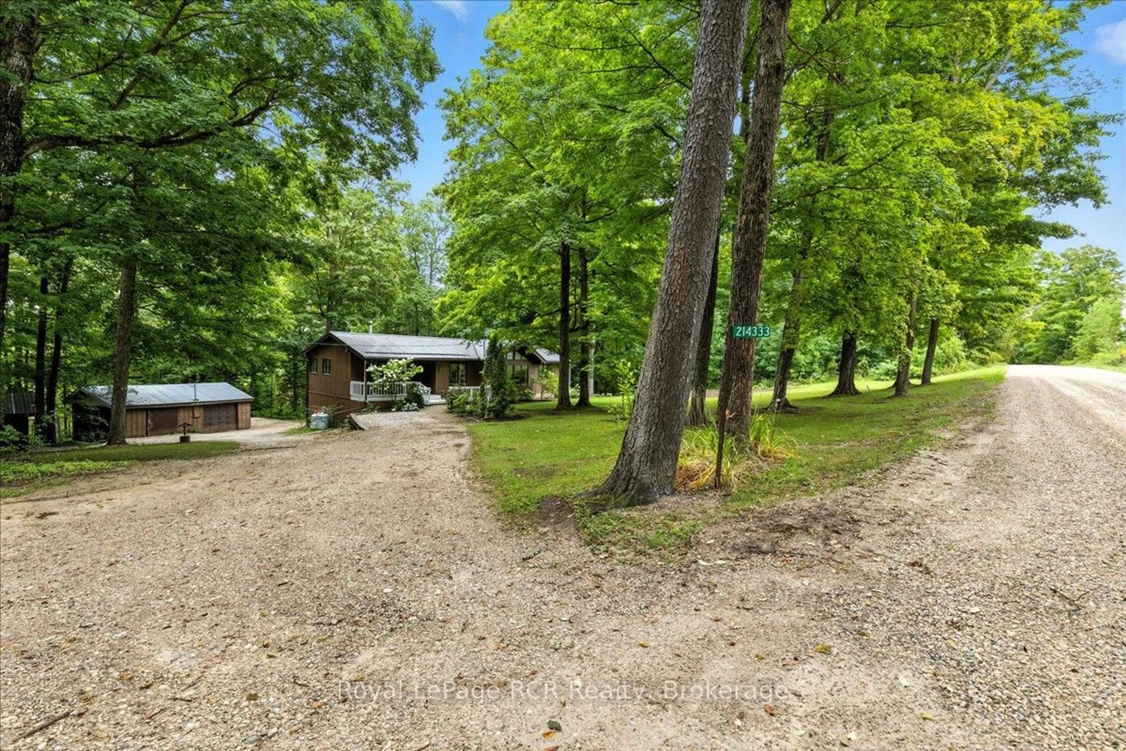 A pic from outside/outdoor area/front of a property/back of a property/a pic from drone, forest/trees view for 214333 Baseline Rd, West Grey Ontario N0G 1S0