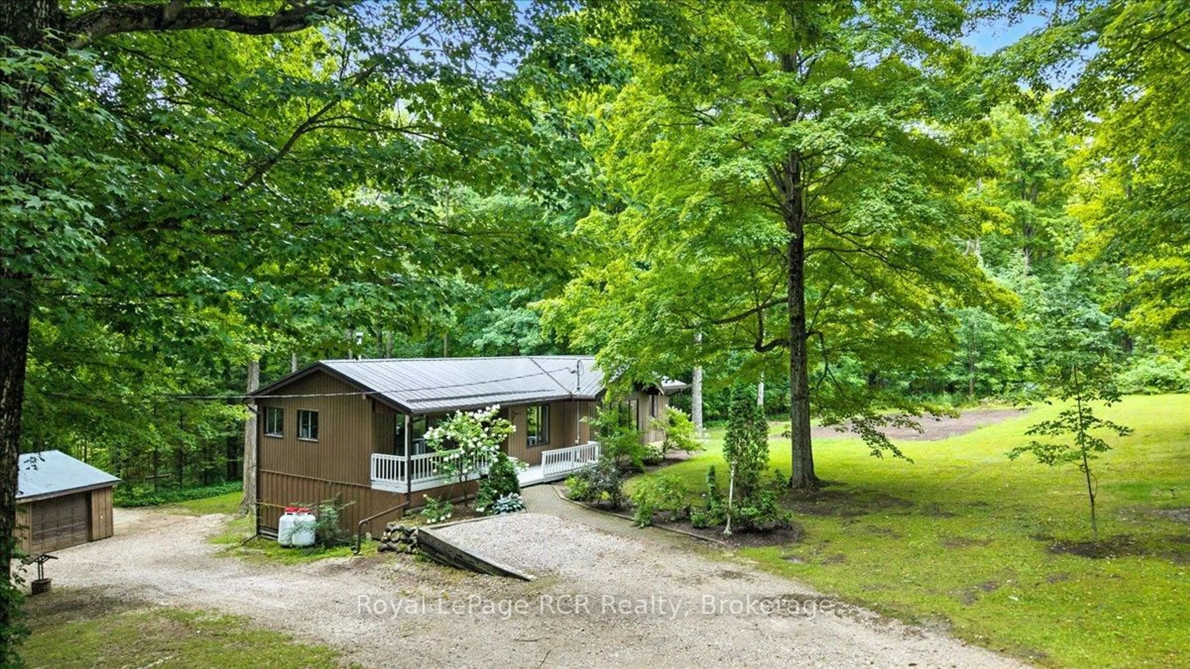 A pic from outside/outdoor area/front of a property/back of a property/a pic from drone, forest/trees view for 214333 Baseline Rd, West Grey Ontario N0G 1S0