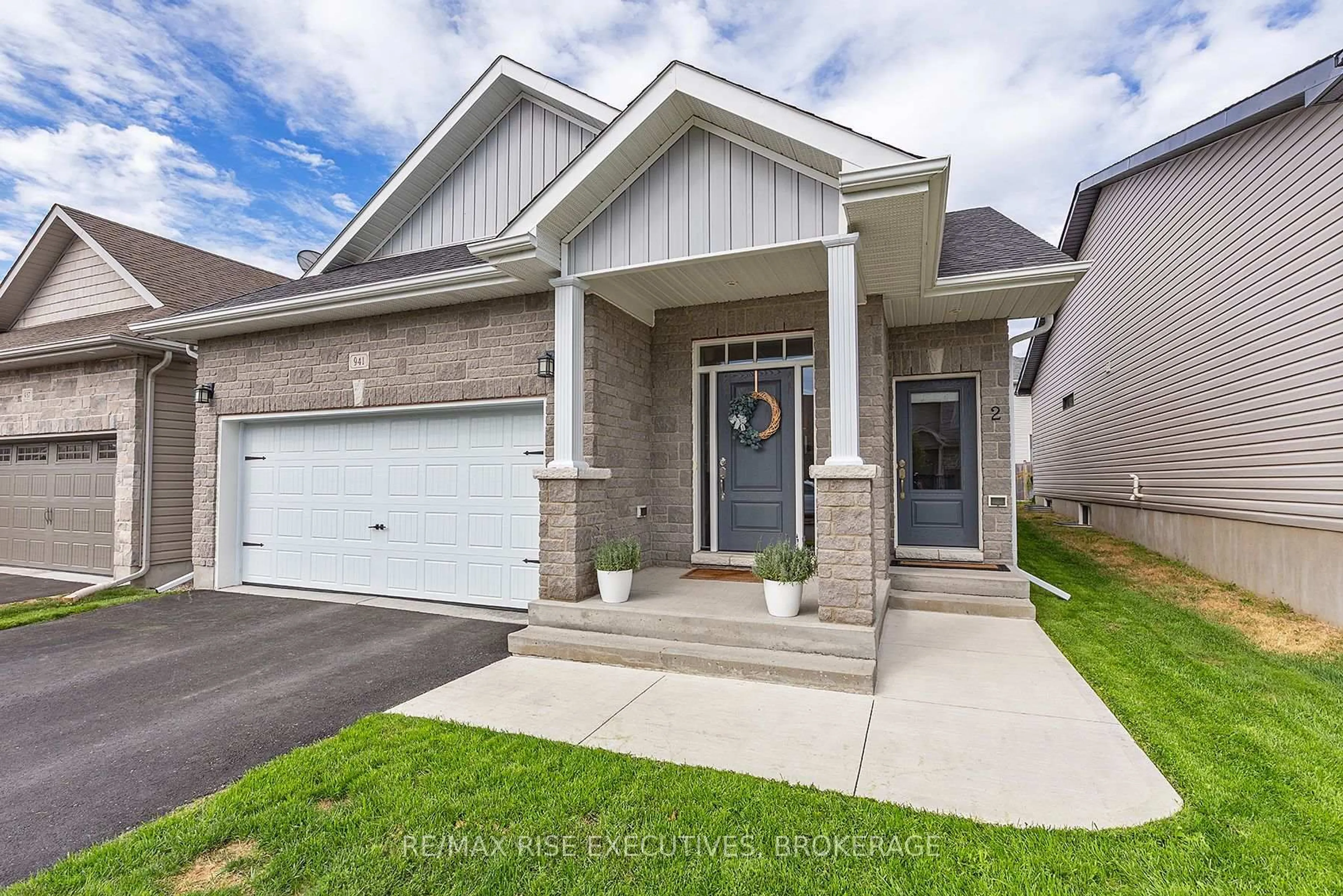 Home with brick exterior material, street for 941 Edward Riley Dr, Kingston Ontario K7P 0J7