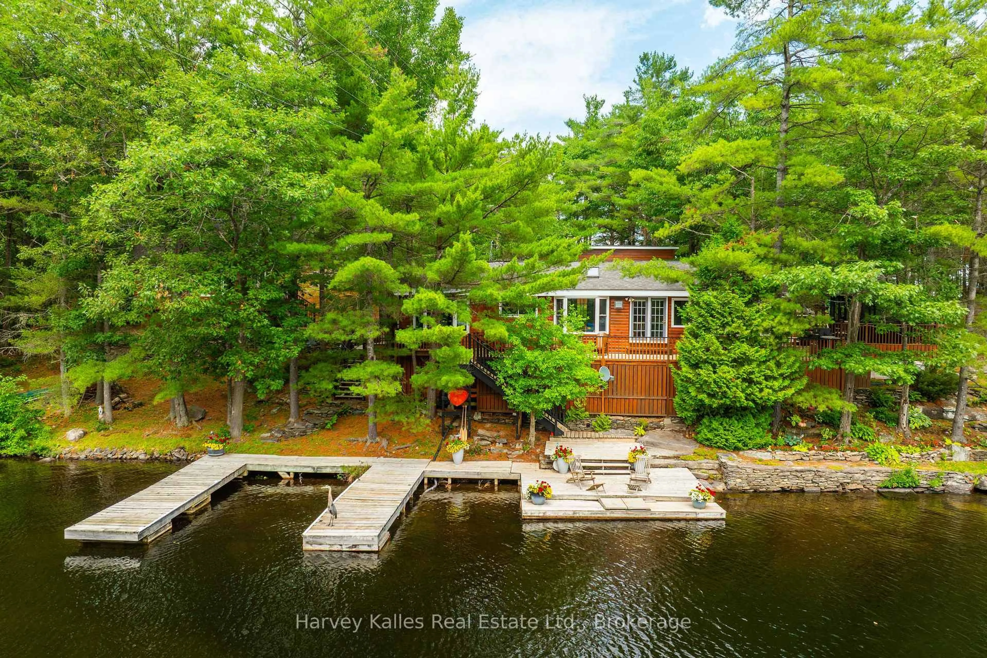 A pic from outside/outdoor area/front of a property/back of a property/a pic from drone, water/lake/river/ocean view for 1078 Mckenzie Rd, Muskoka Lakes Ontario P1P 1A4