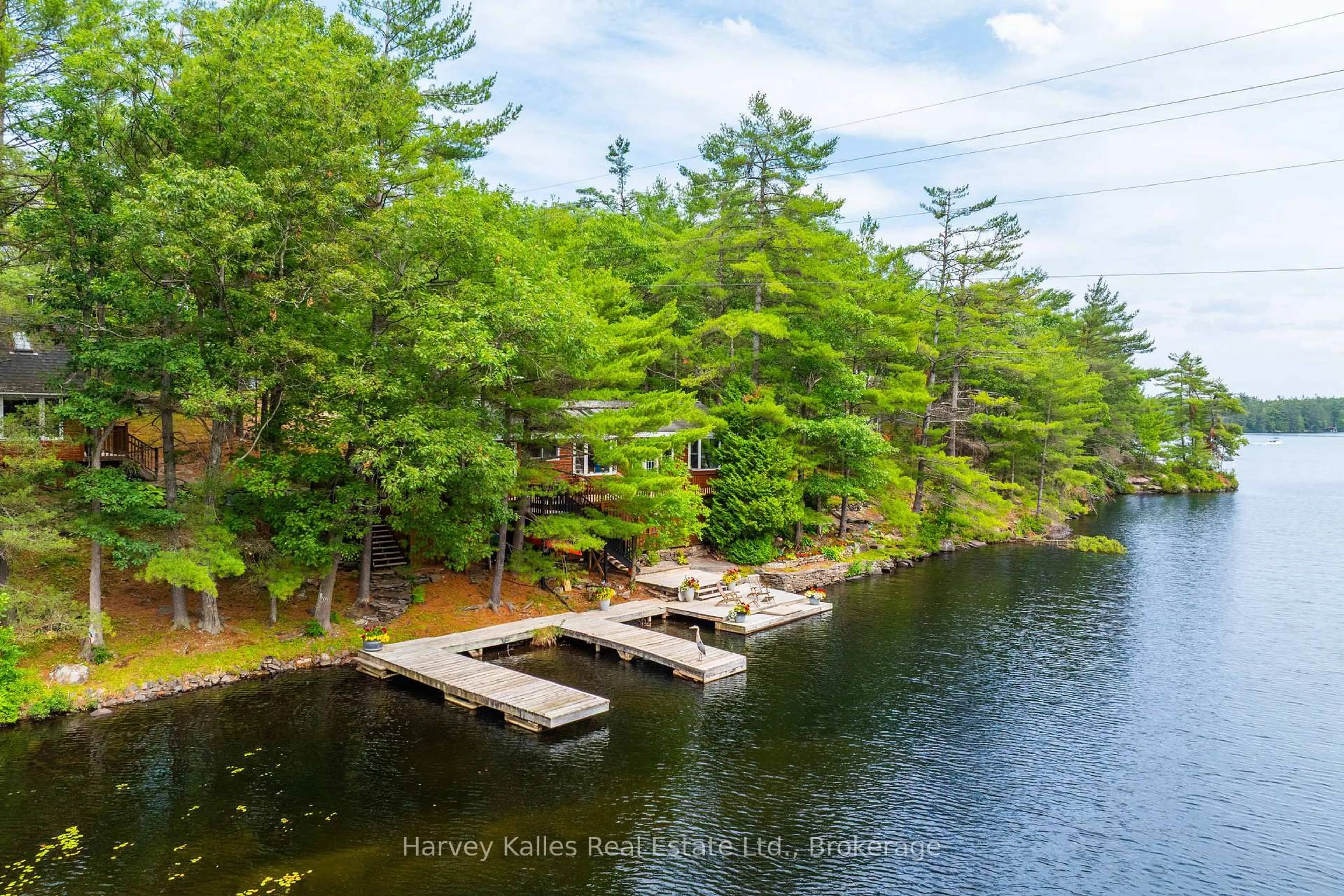 A pic from outside/outdoor area/front of a property/back of a property/a pic from drone, water/lake/river/ocean view for 1078 Mckenzie Rd, Muskoka Lakes Ontario P1P 1A4