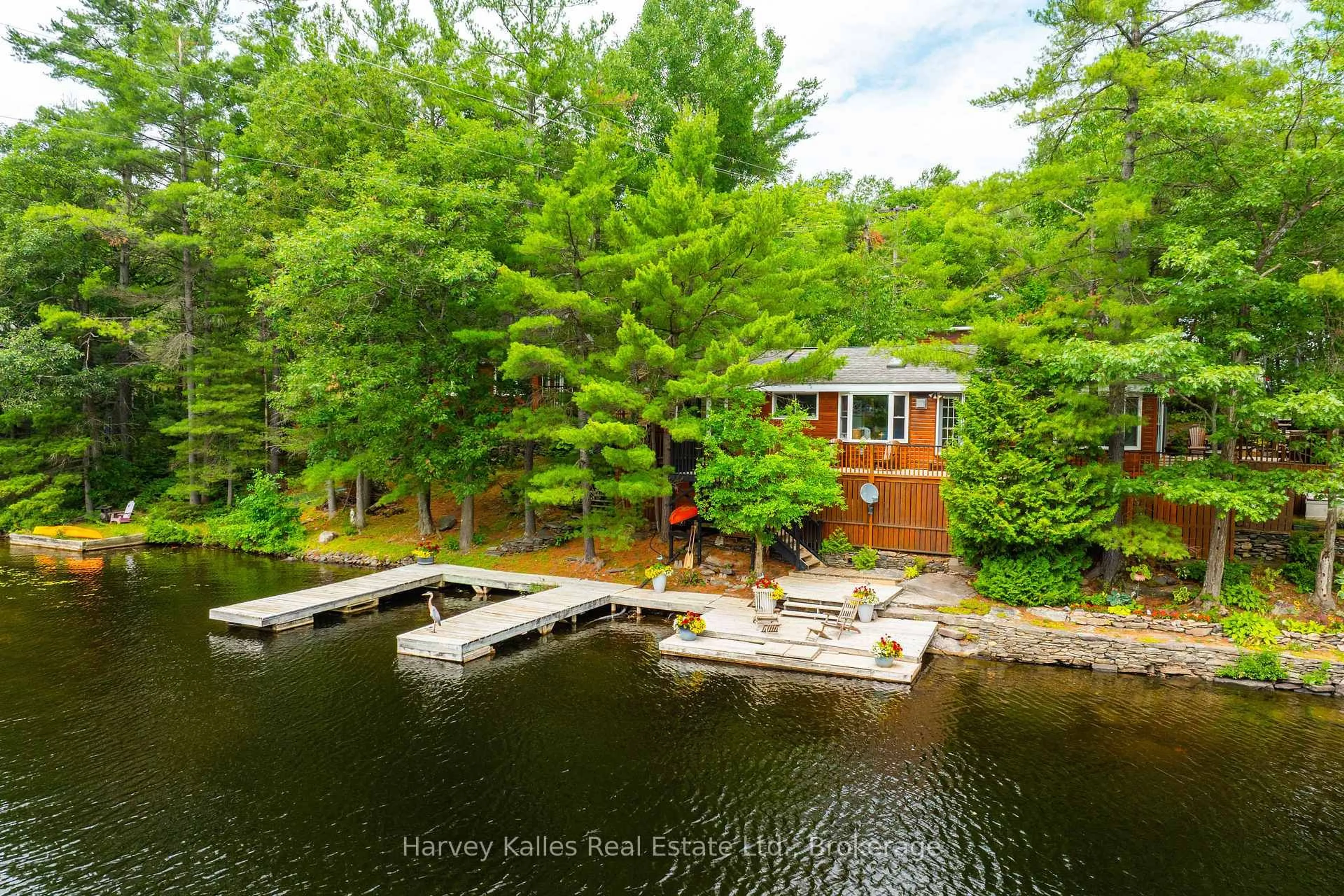 A pic from outside/outdoor area/front of a property/back of a property/a pic from drone, water/lake/river/ocean view for 1078 Mckenzie Rd, Muskoka Lakes Ontario P1P 1A4