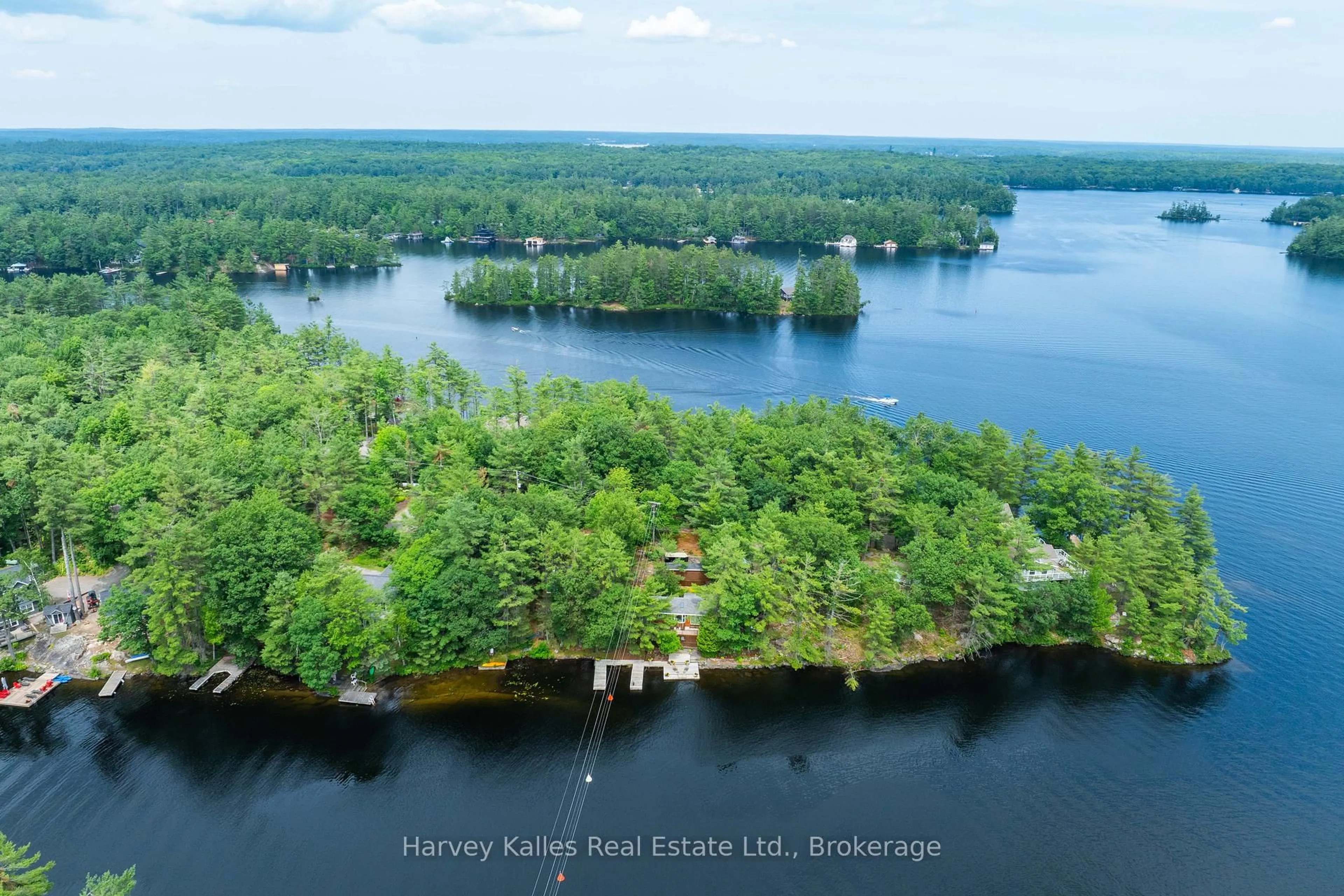 A pic from outside/outdoor area/front of a property/back of a property/a pic from drone, water/lake/river/ocean view for 1078 Mckenzie Rd, Muskoka Lakes Ontario P1P 1A4