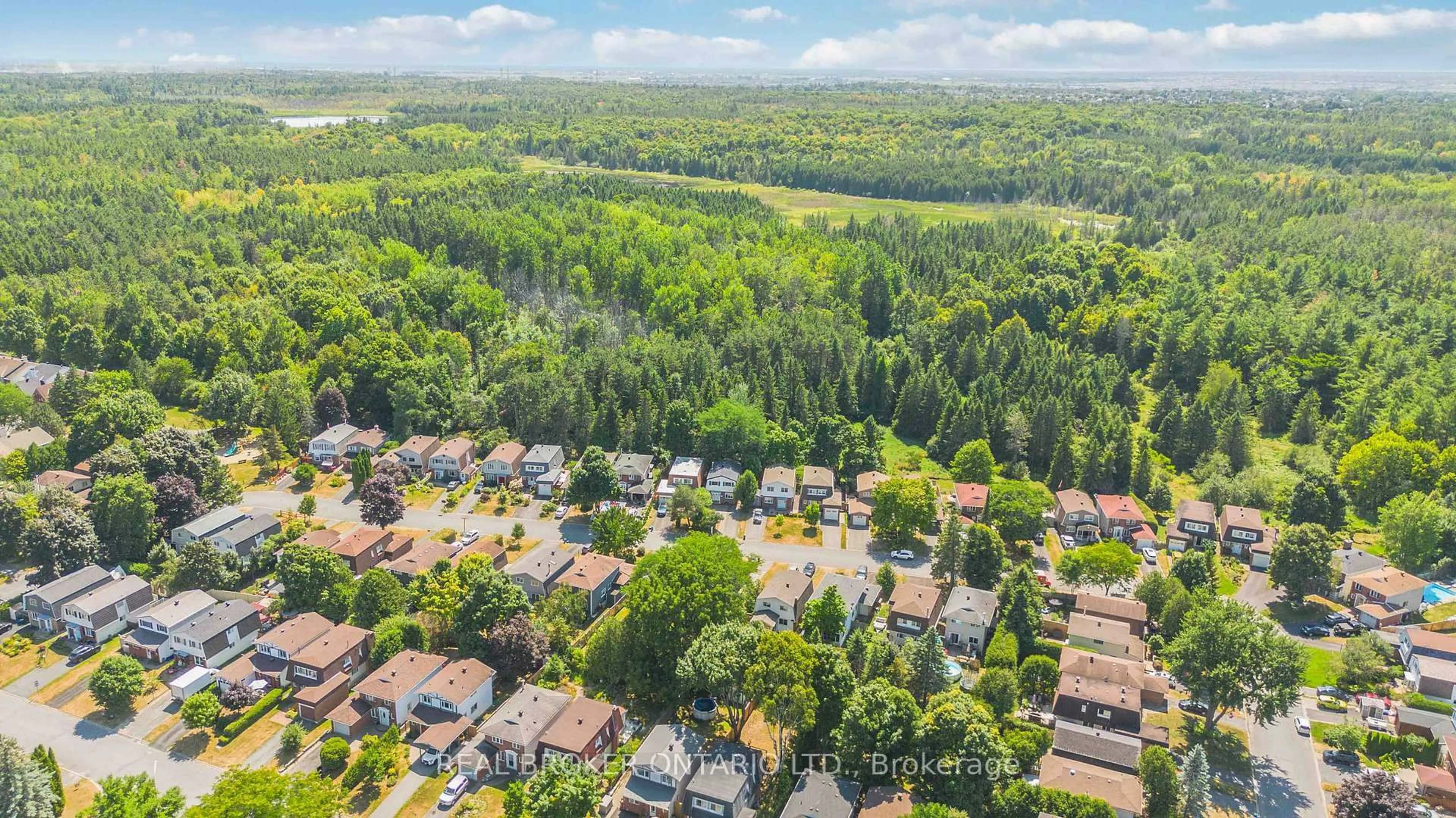 A pic from outside/outdoor area/front of a property/back of a property/a pic from drone, forest/trees view for 77 Priam Way, Ottawa Ontario K2H 8S7