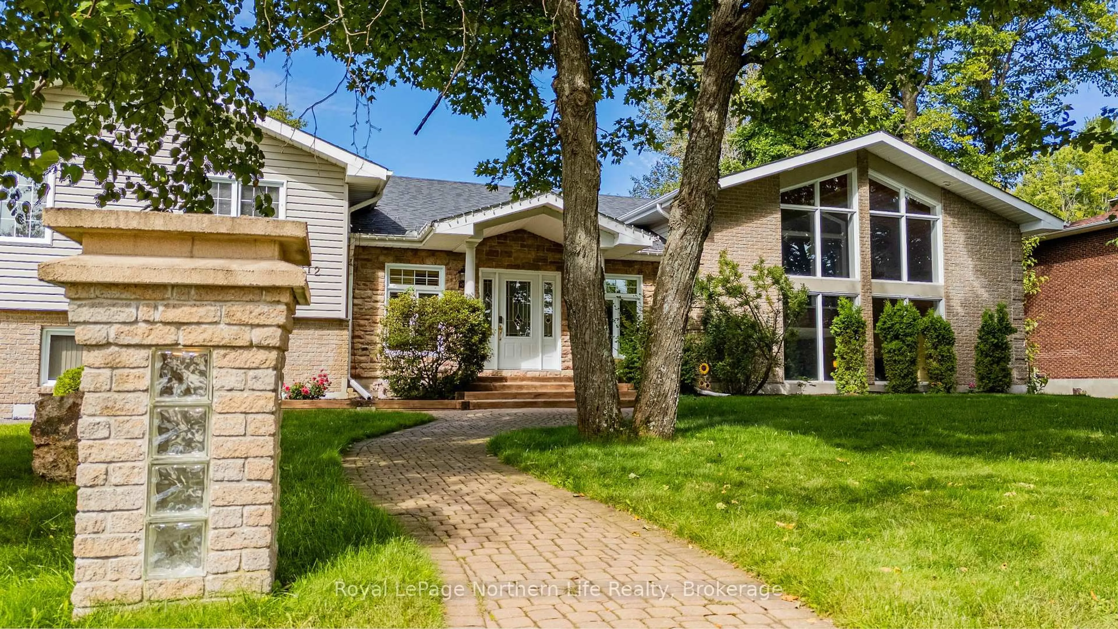 Home with brick exterior material, street for 112 Wallace Heights Dr, North Bay Ontario P1C 1E6