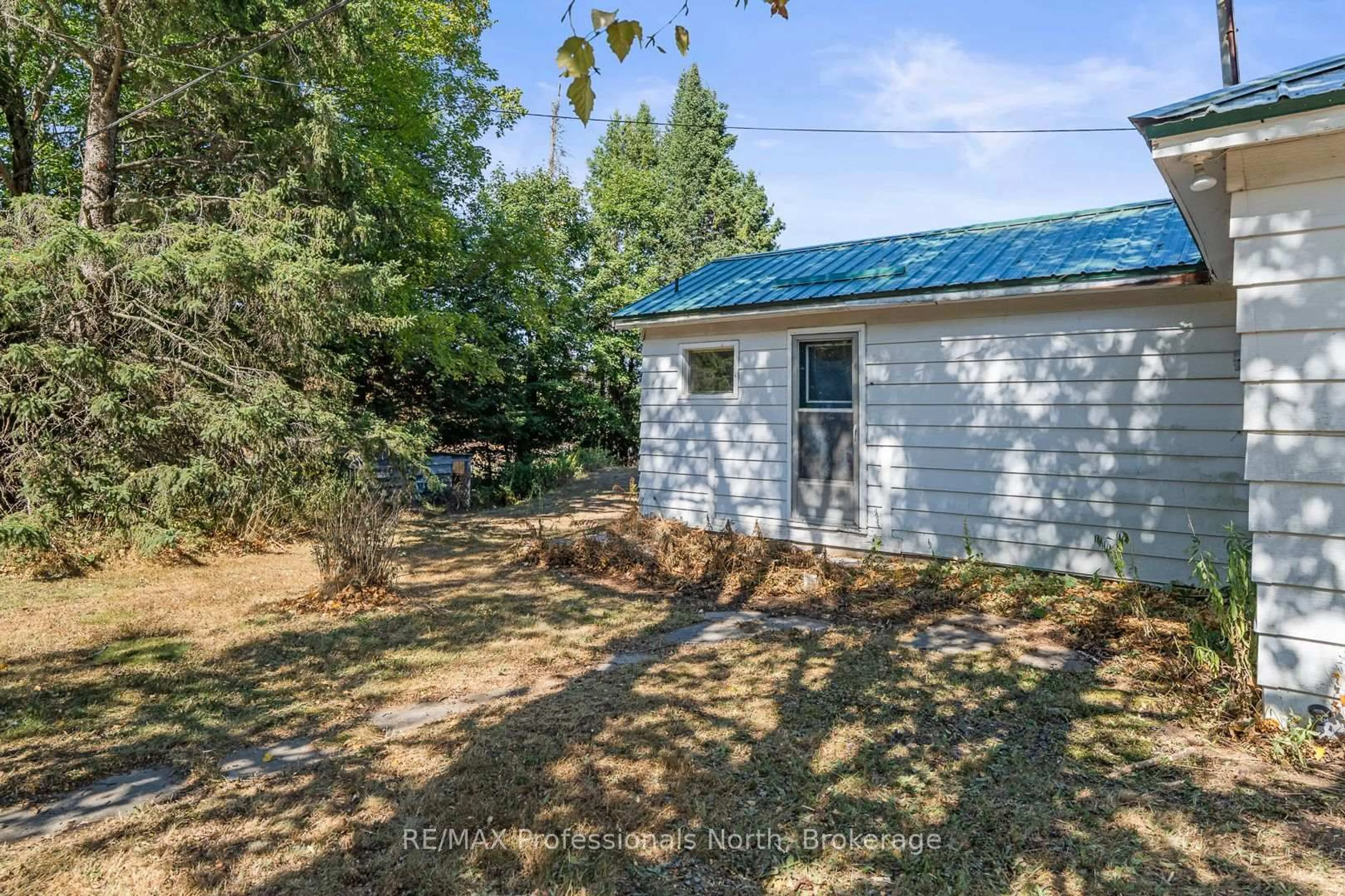 A pic from outside/outdoor area/front of a property/back of a property/a pic from drone, forest/trees view for 60 Mountain St, Dysart et al Ontario K0M 1S0