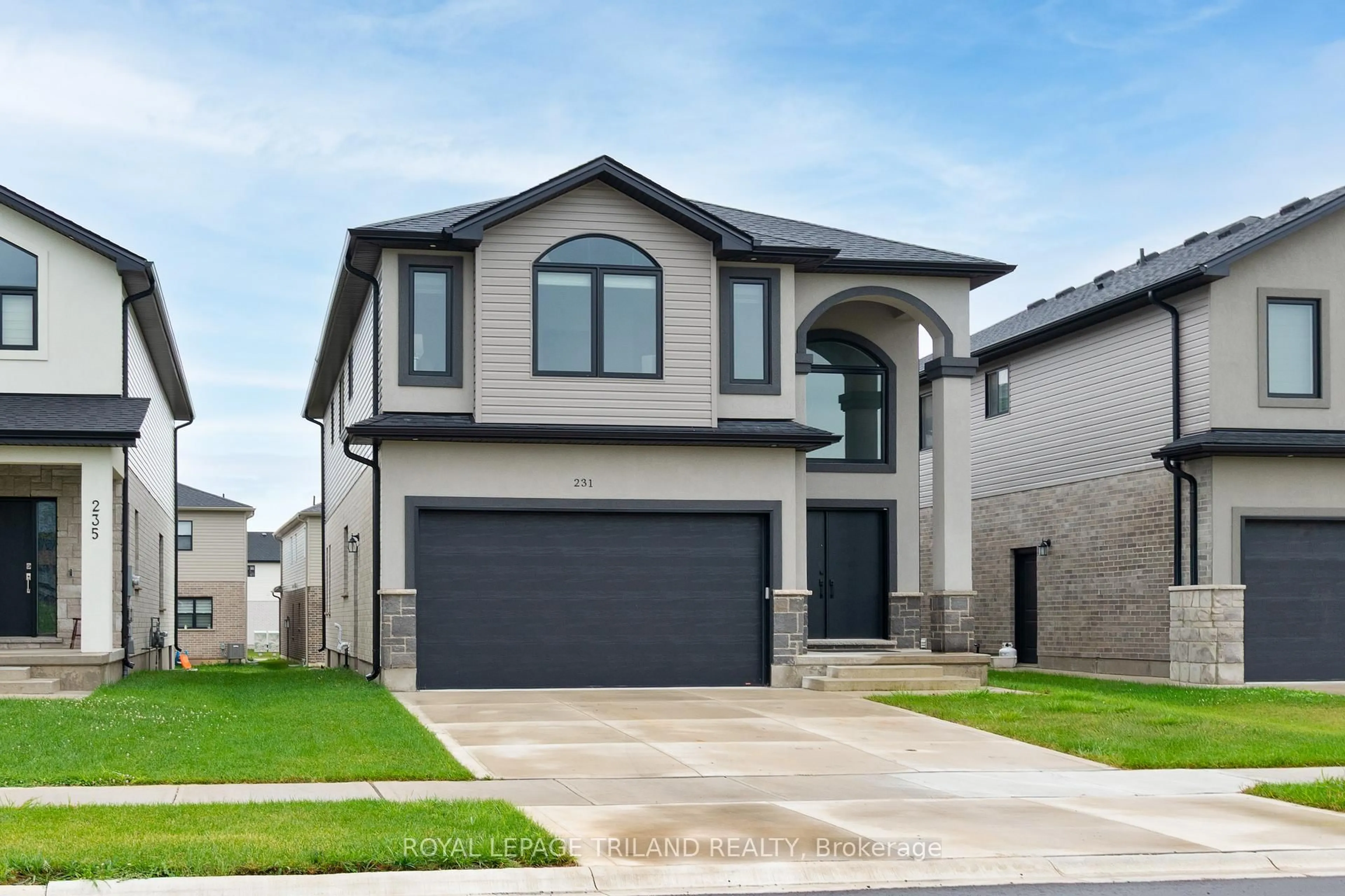 Home with vinyl exterior material, street for 231 Roy Mcdonald Dr, London South Ontario N6L 0J1