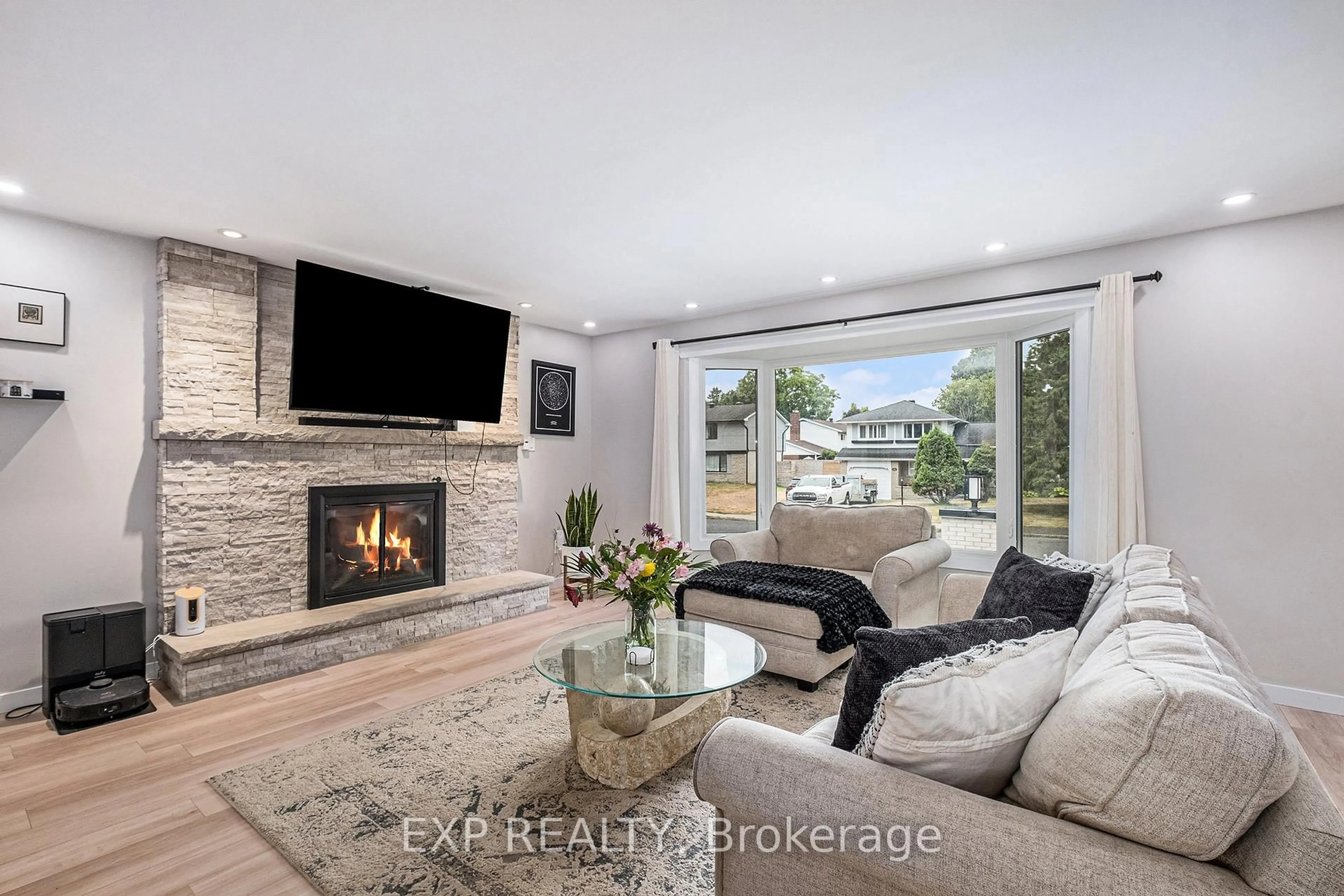 Living room with furniture, ceramic/tile floor for 3 St Remy Dr, Barrhaven Ontario K2J 1A4